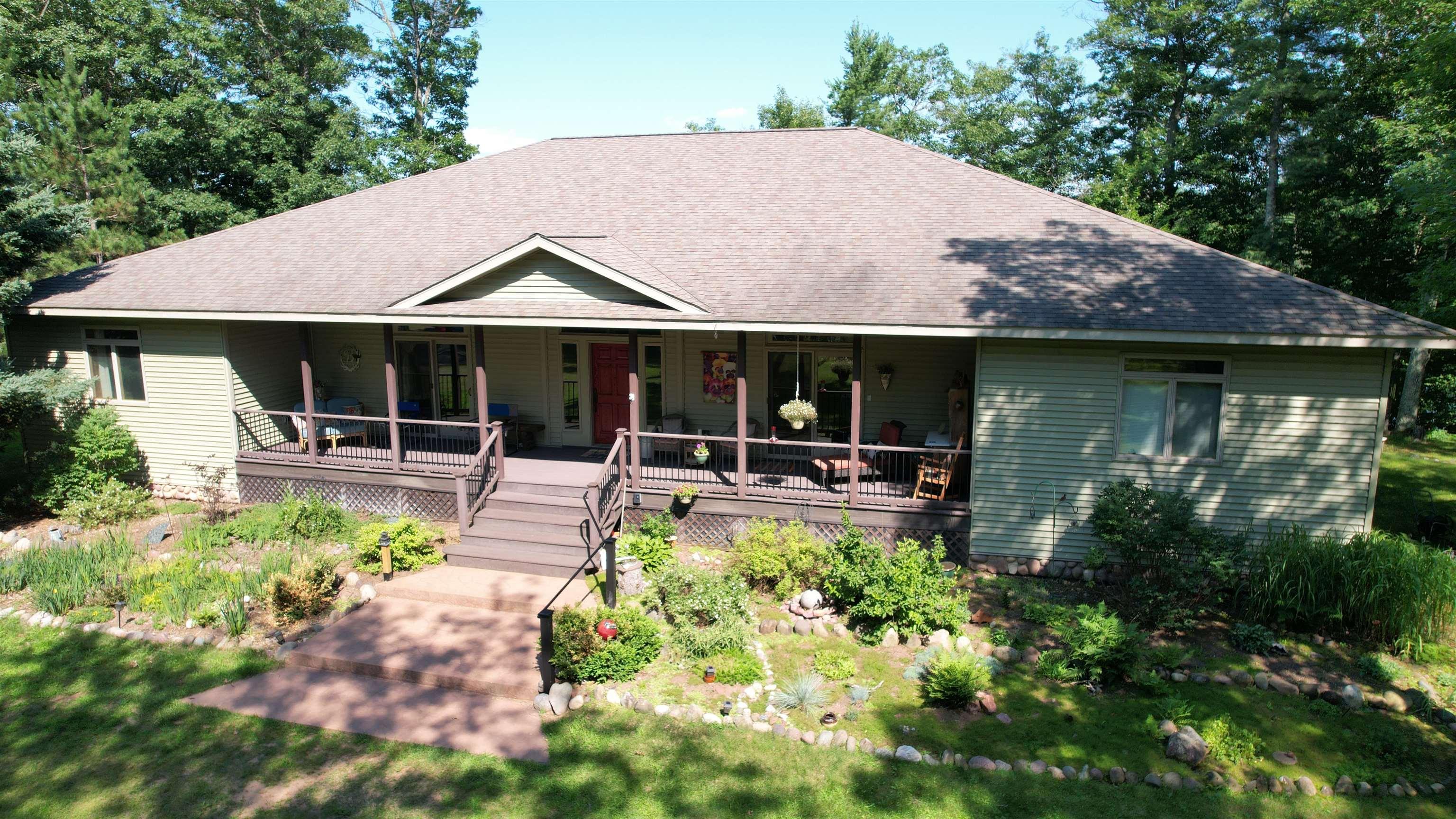 Image 0: Access each wing from the common entrance, or via patio door off of each kitchen., Main Entrance