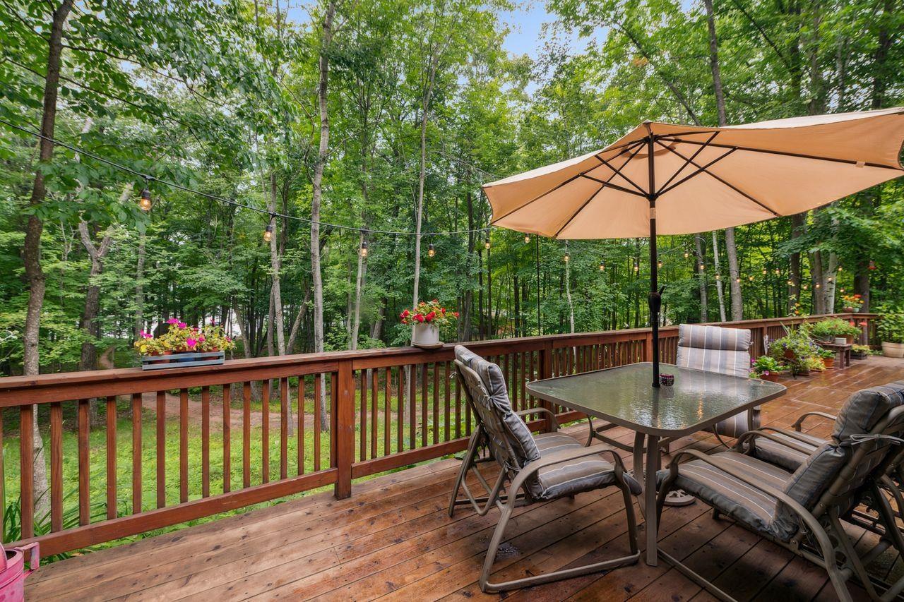 Image 3: Wooden terrace featuring outdoor dining area, Deck