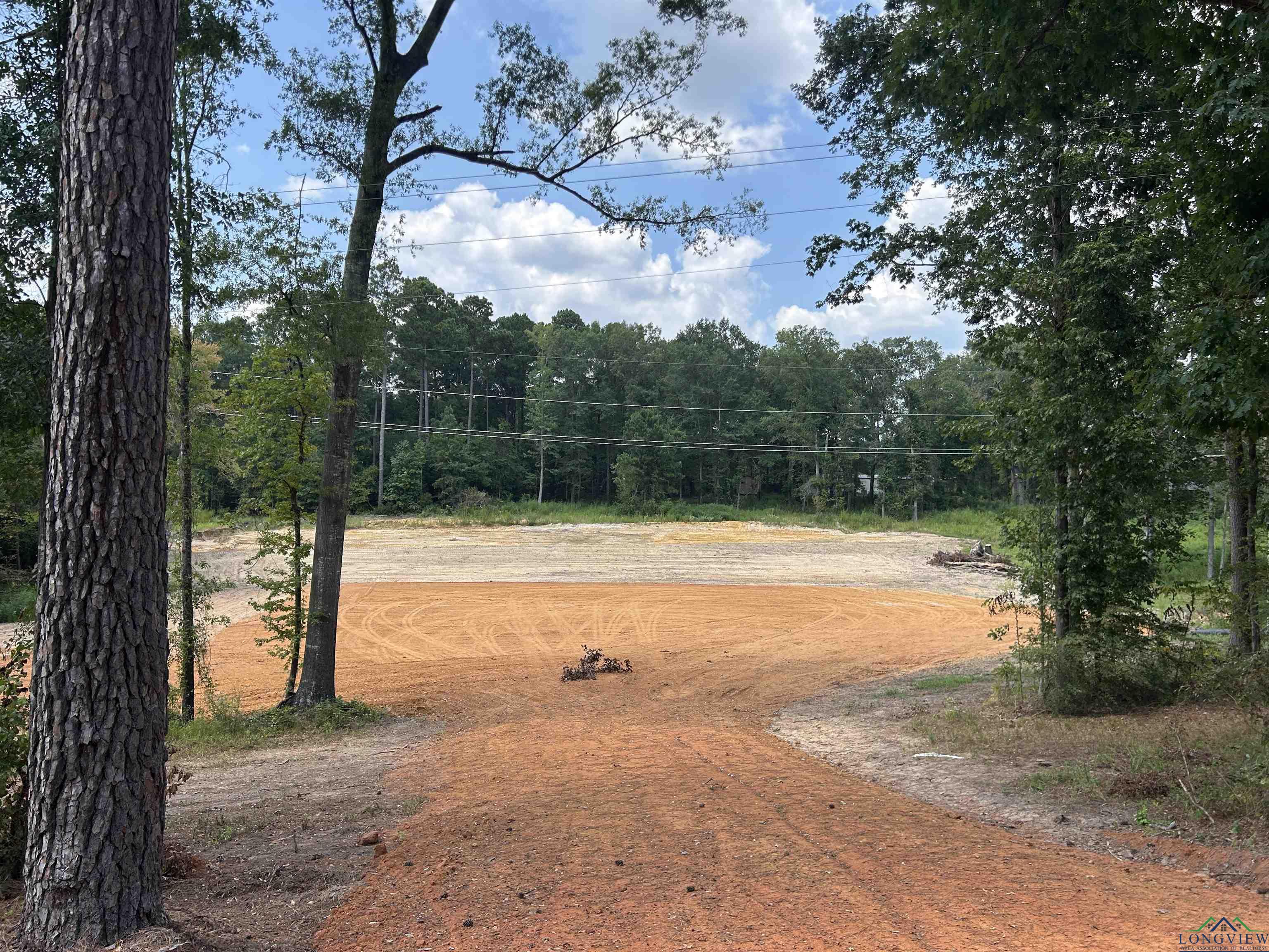 Image 0: View of home's community featuring a forest view, Community