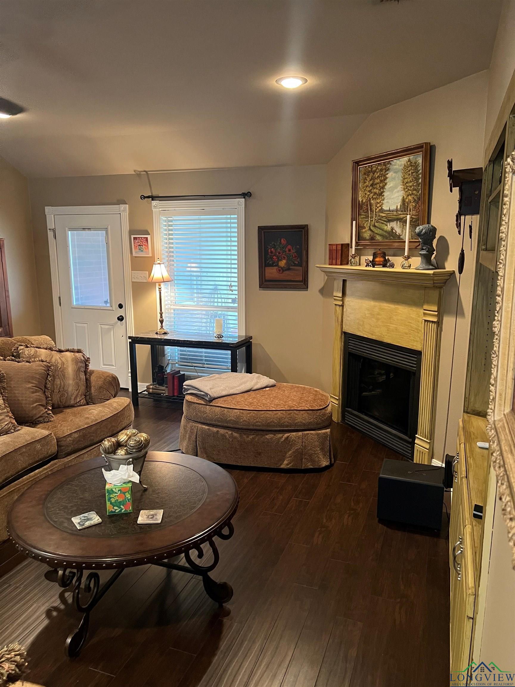 Image 3: Living room with vaulted ceiling and dark hardwood / wood-style floors, Living Room