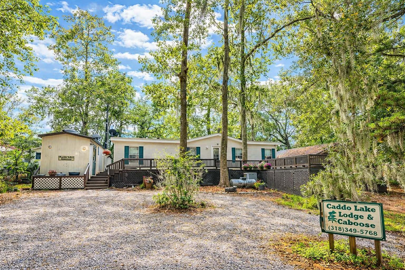 Image 0: Manufactured / mobile home with a deck, Front Of Structure