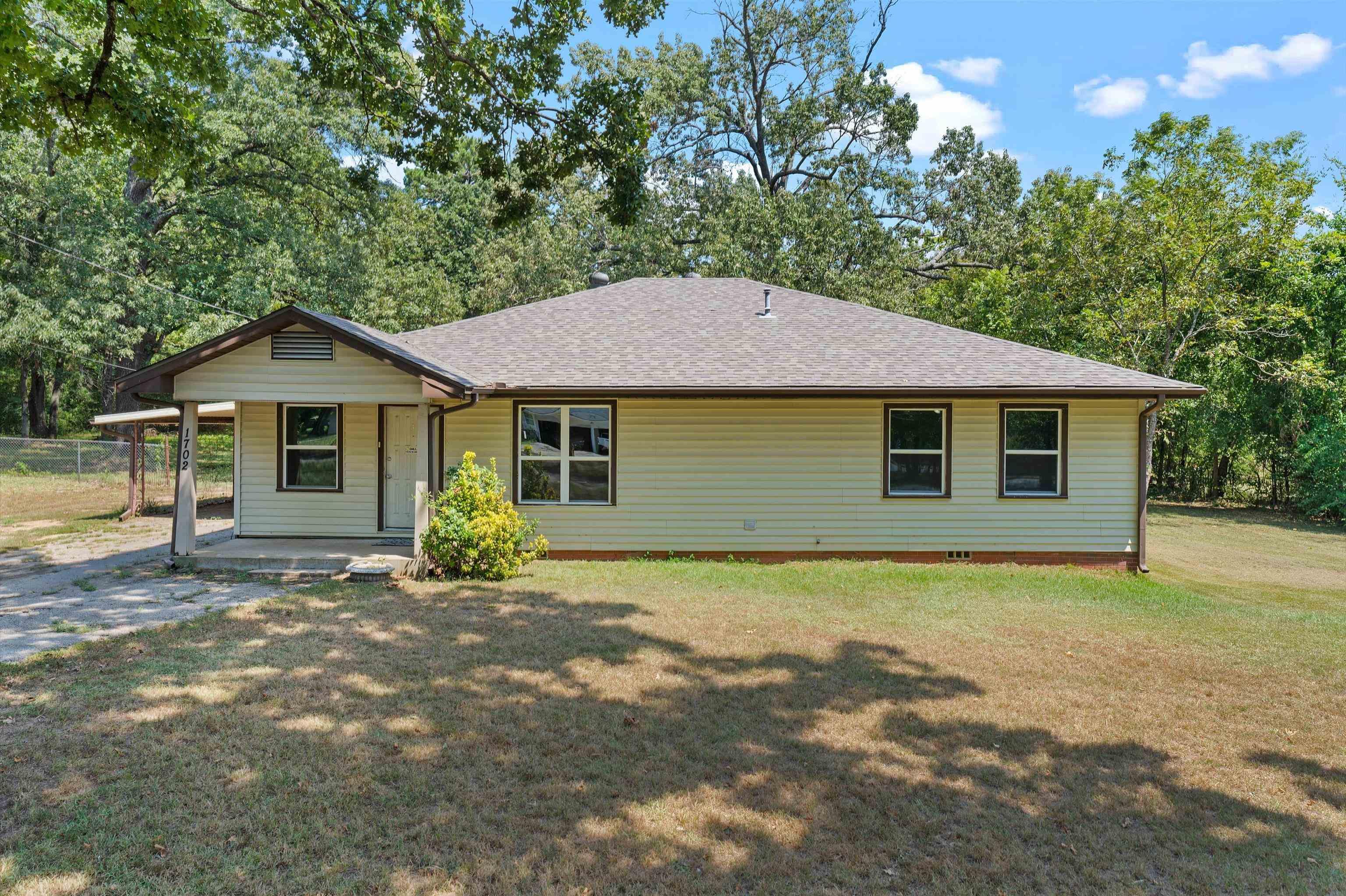 Image 0: View of front of house with roof with shingles, a front yard, covered porch, and crawl space, Front Of Structure
