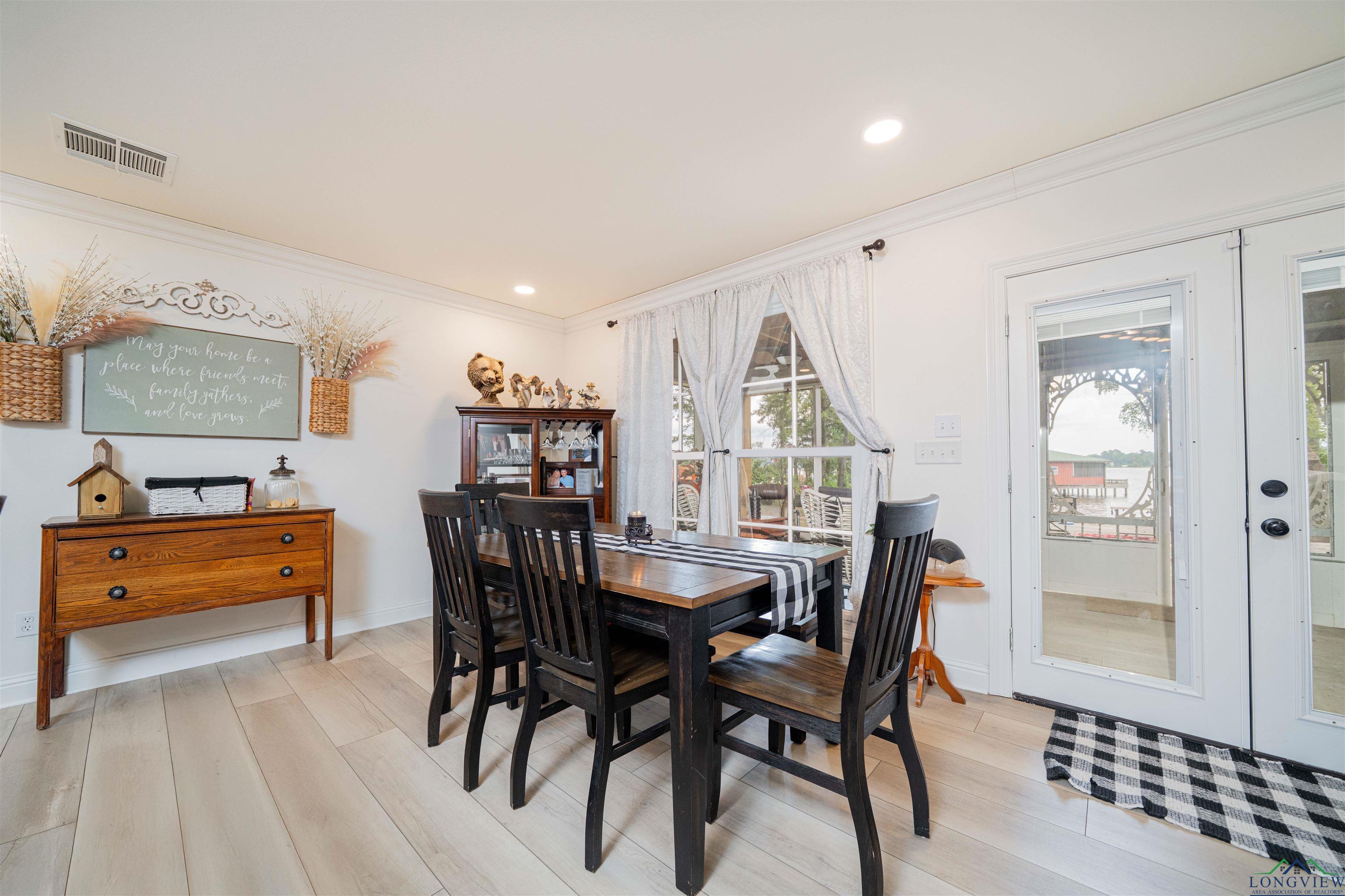 Image 3: Dining room featuring crown molding, light wood-type flooring, recessed lighting, and french doors, Dining Area