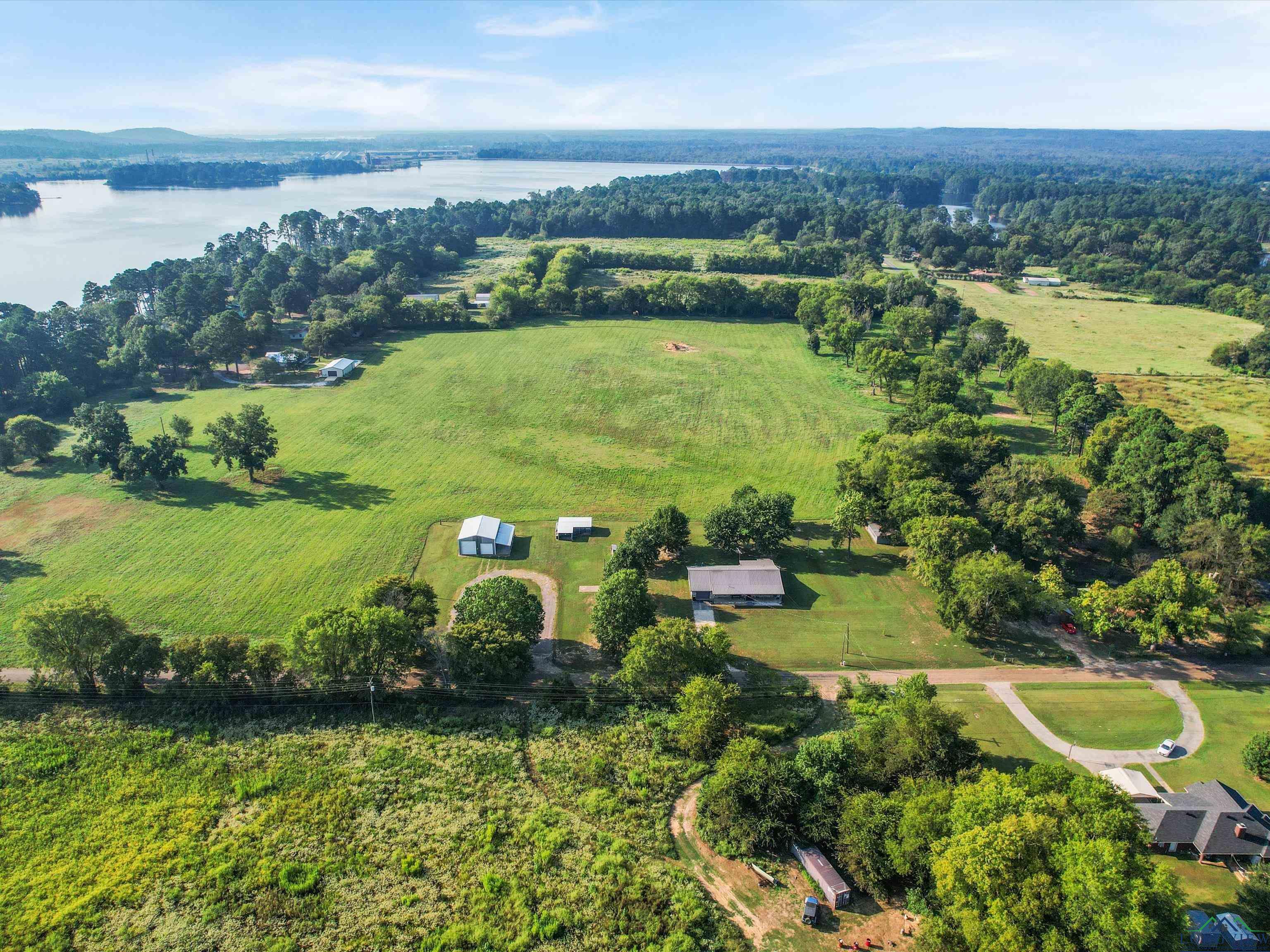 Image 1: View of property location with a large body of water and rural landscape, Aerial View