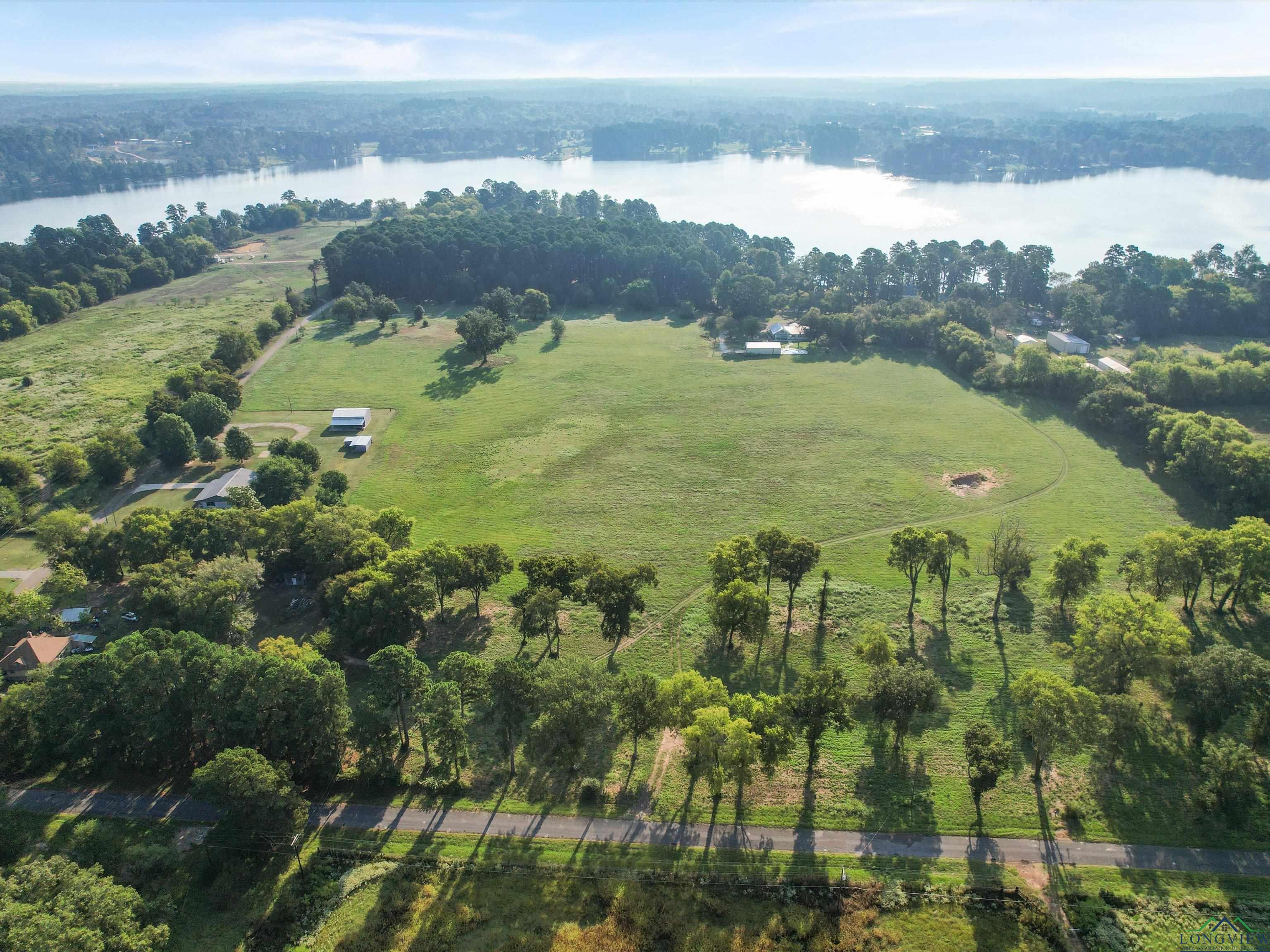 Image 3: Aerial view of property and surrounding area featuring a large body of water, Aerial View