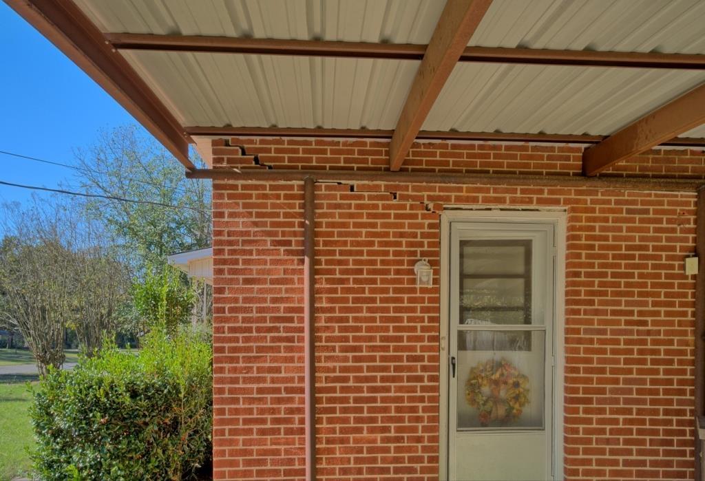 Image 2: Property entrance featuring brick siding, Entry