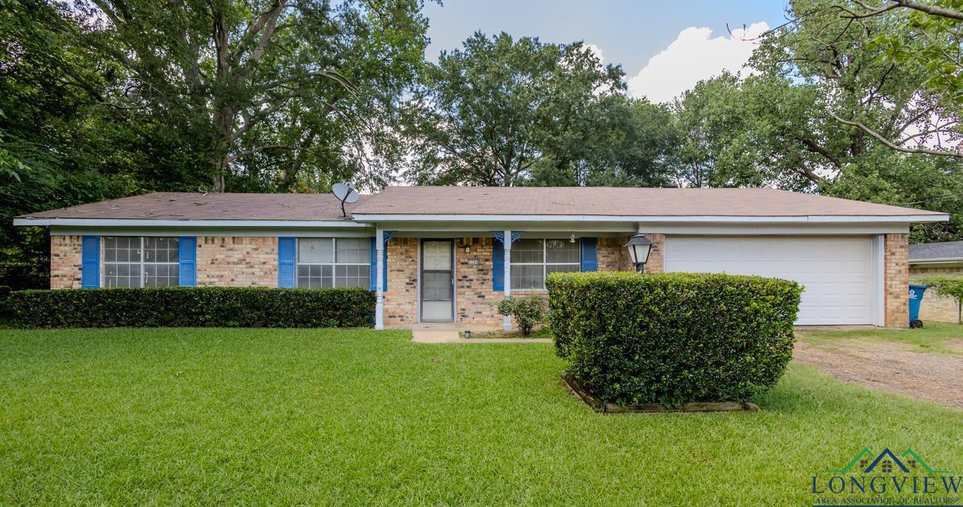 Image 0: Ranch-style house with brick siding, dirt driveway, and a front lawn, Front Of Structure