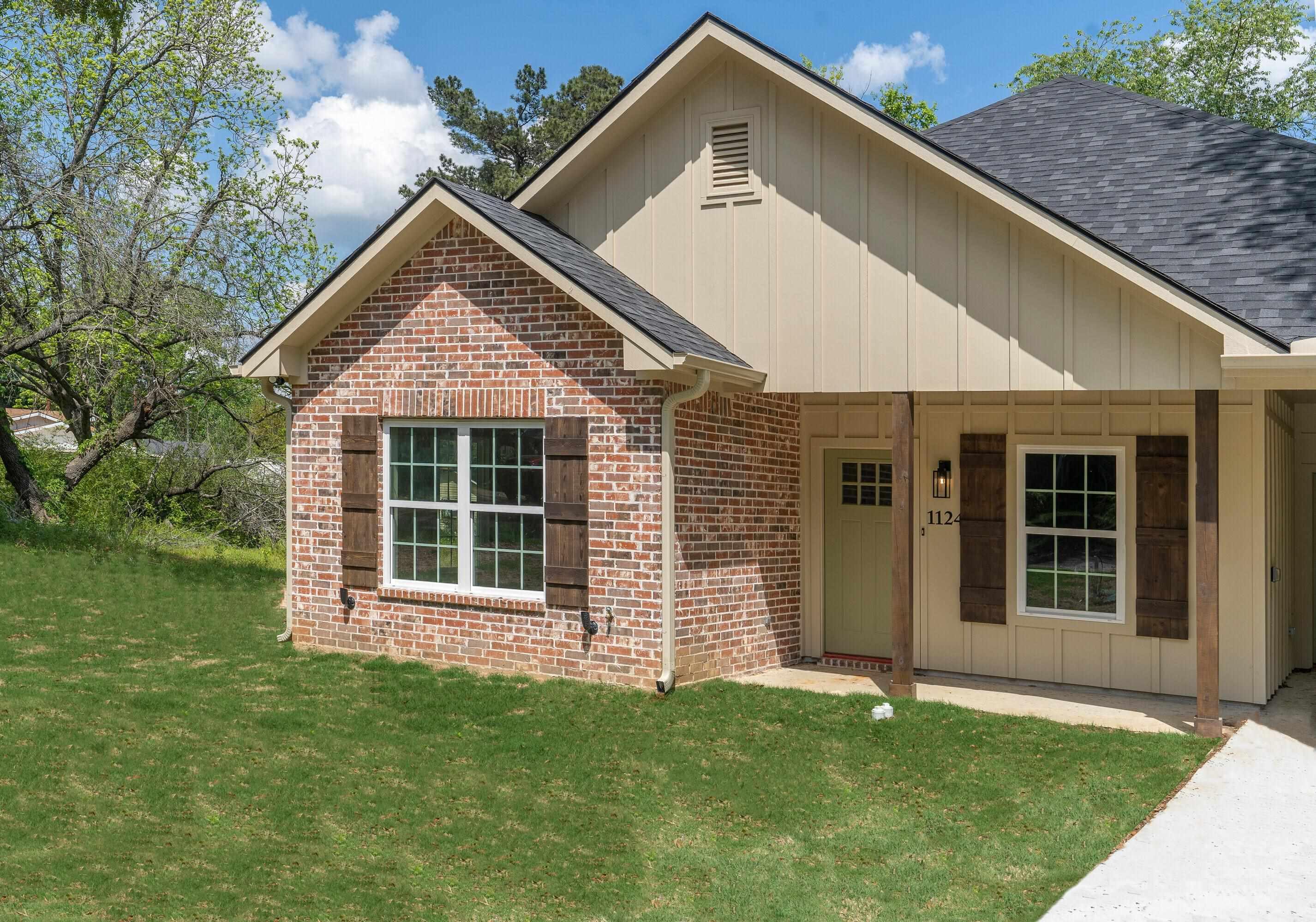 Image 0: View of front of house with a shingled roof, board and batten siding, and a front lawn, Front Of Structure