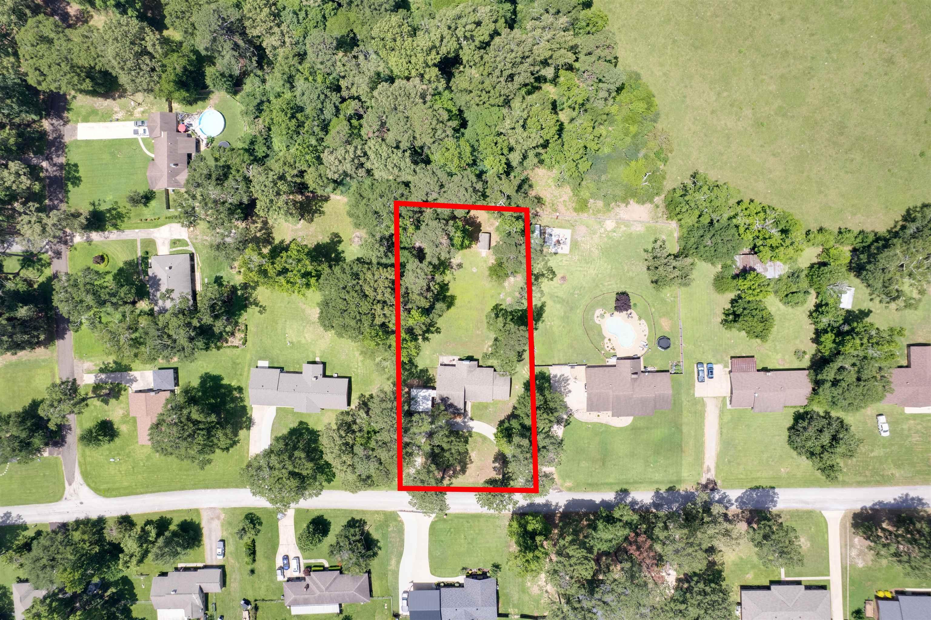 Image 1: Expansive property featuring mature trees and a manicured lawn, Aerial View