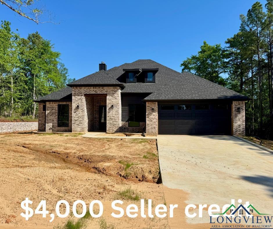 Image 0: View of front of property featuring brick siding, a garage, a shingled roof, concrete driveway, and a chimney, Front Of Structure