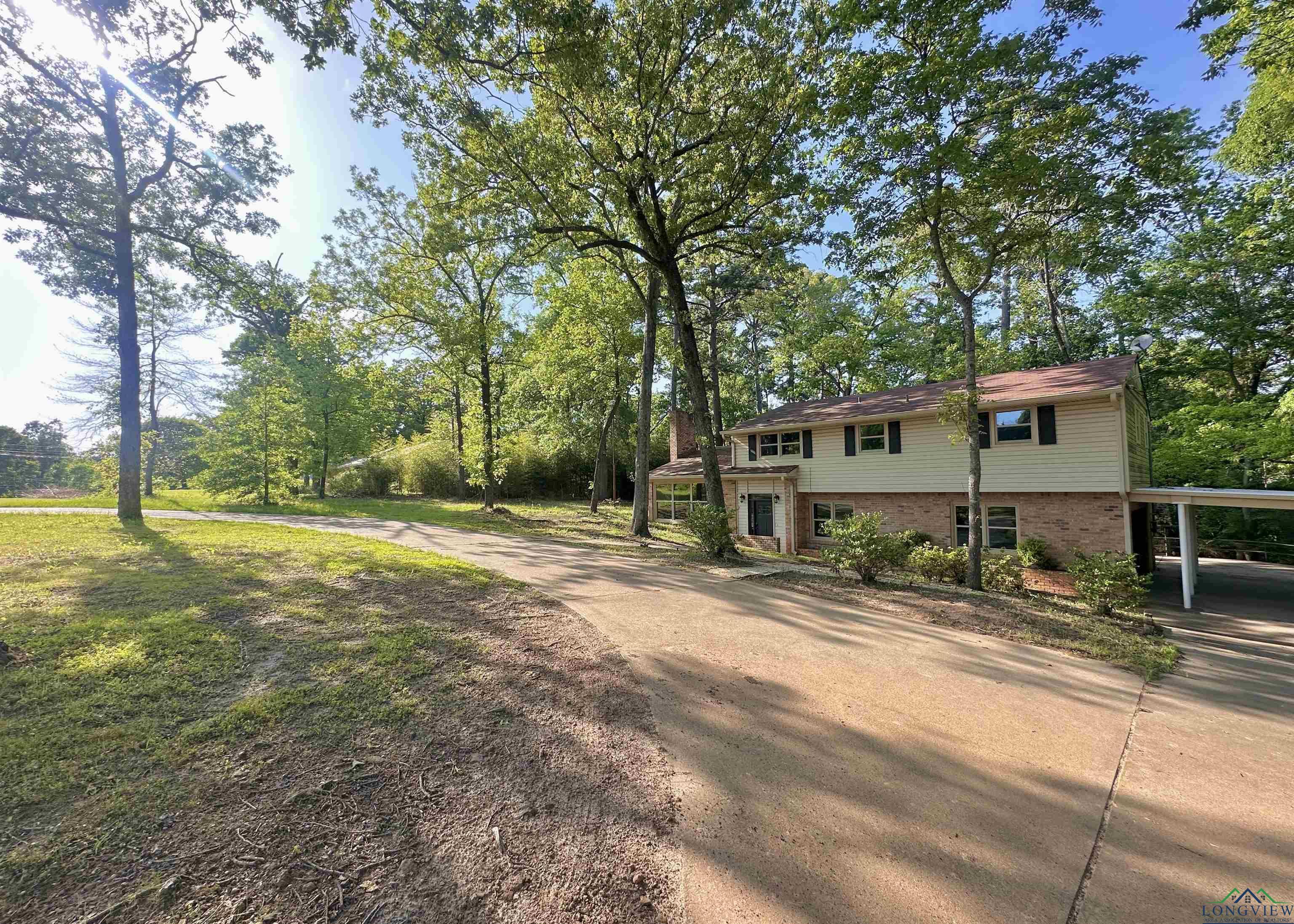 Image 0: View of front of home featuring brick siding, Front Of Structure