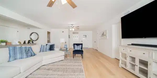 Image 3: Living room with light wood-style flooring and ceiling fan, Living Room