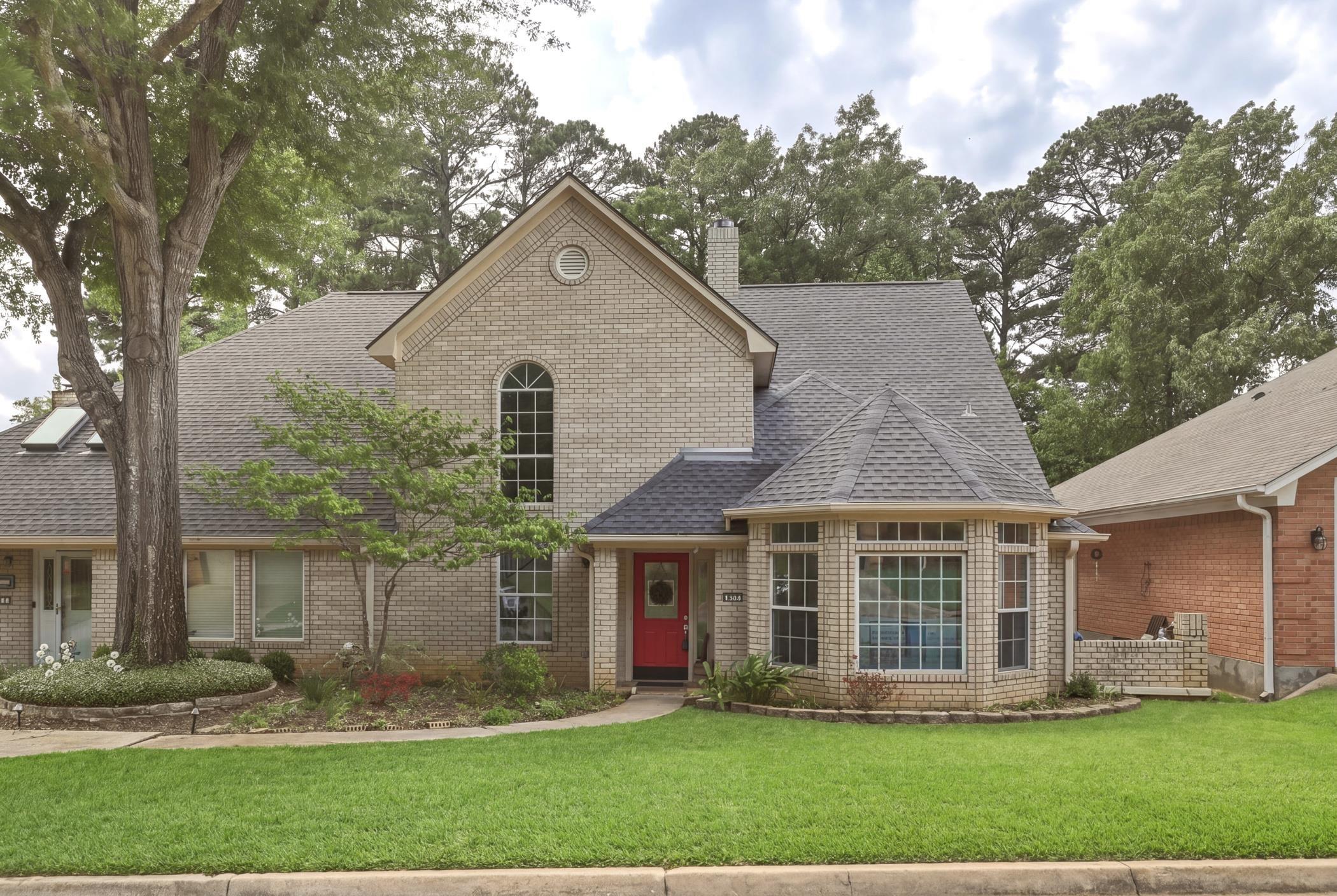 Image 0: View of front facade featuring roof with shingles, a front yard, a chimney, and brick siding, Front Of Structure