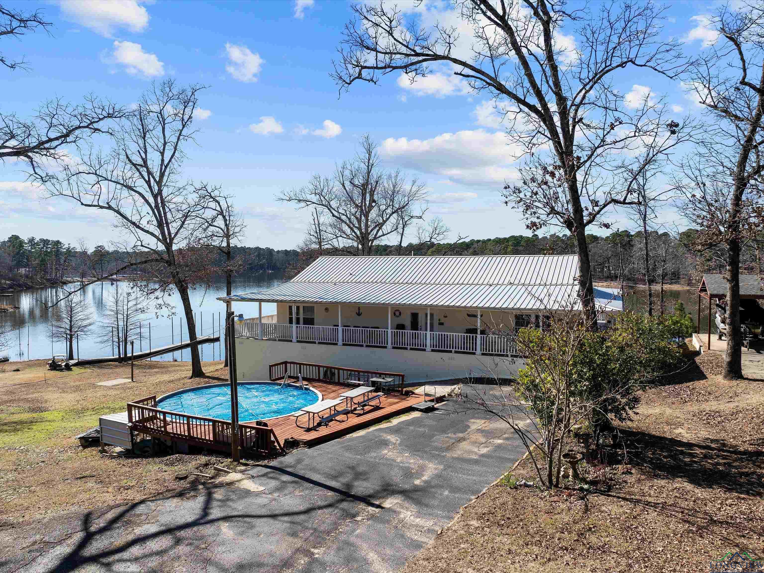 Image 0: Swimming pool featuring a water view, Pool