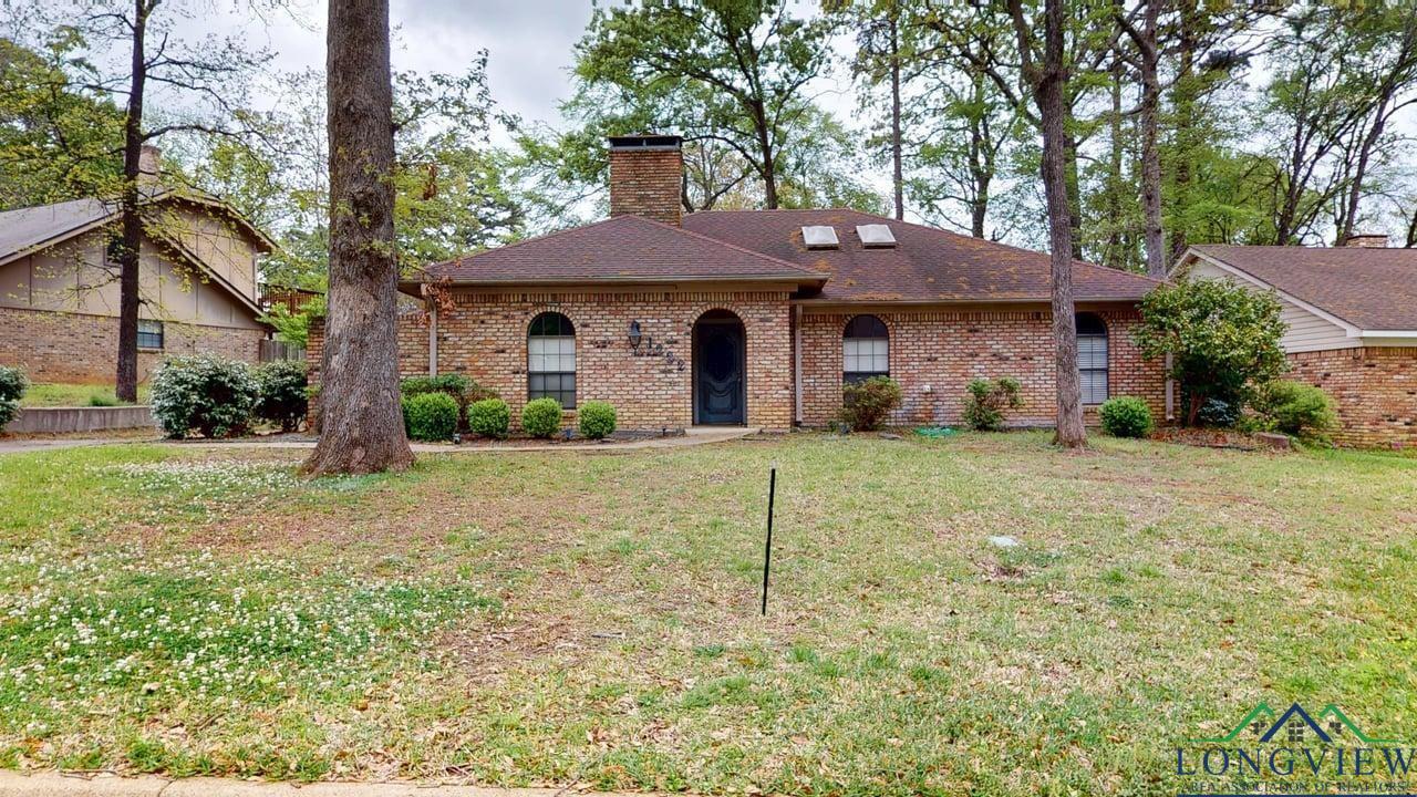 Image 0: Single story home with brick siding, a chimney, and a front yard, Front Of Structure