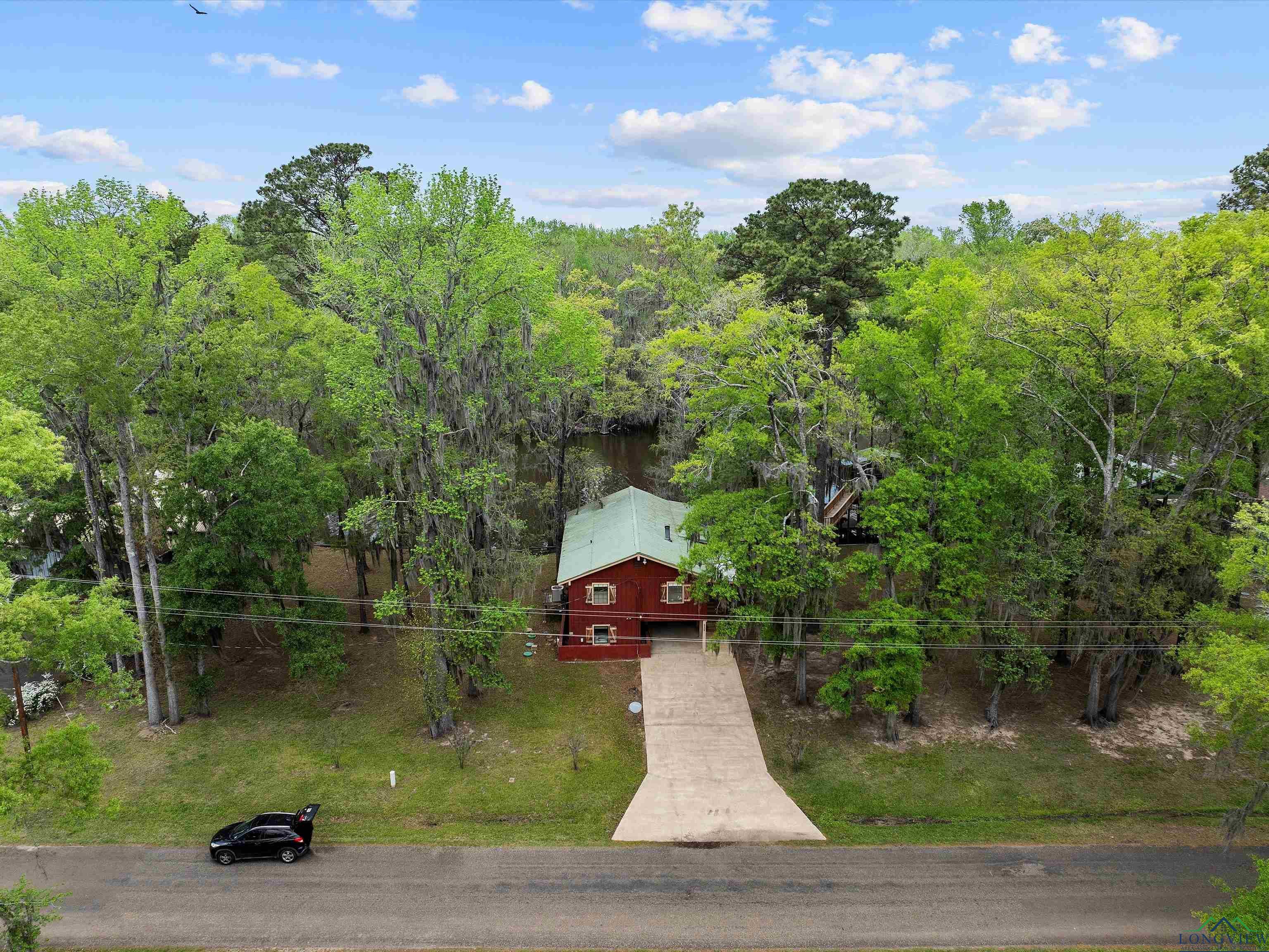 Image 2: View of subject property with a forest, Aerial View