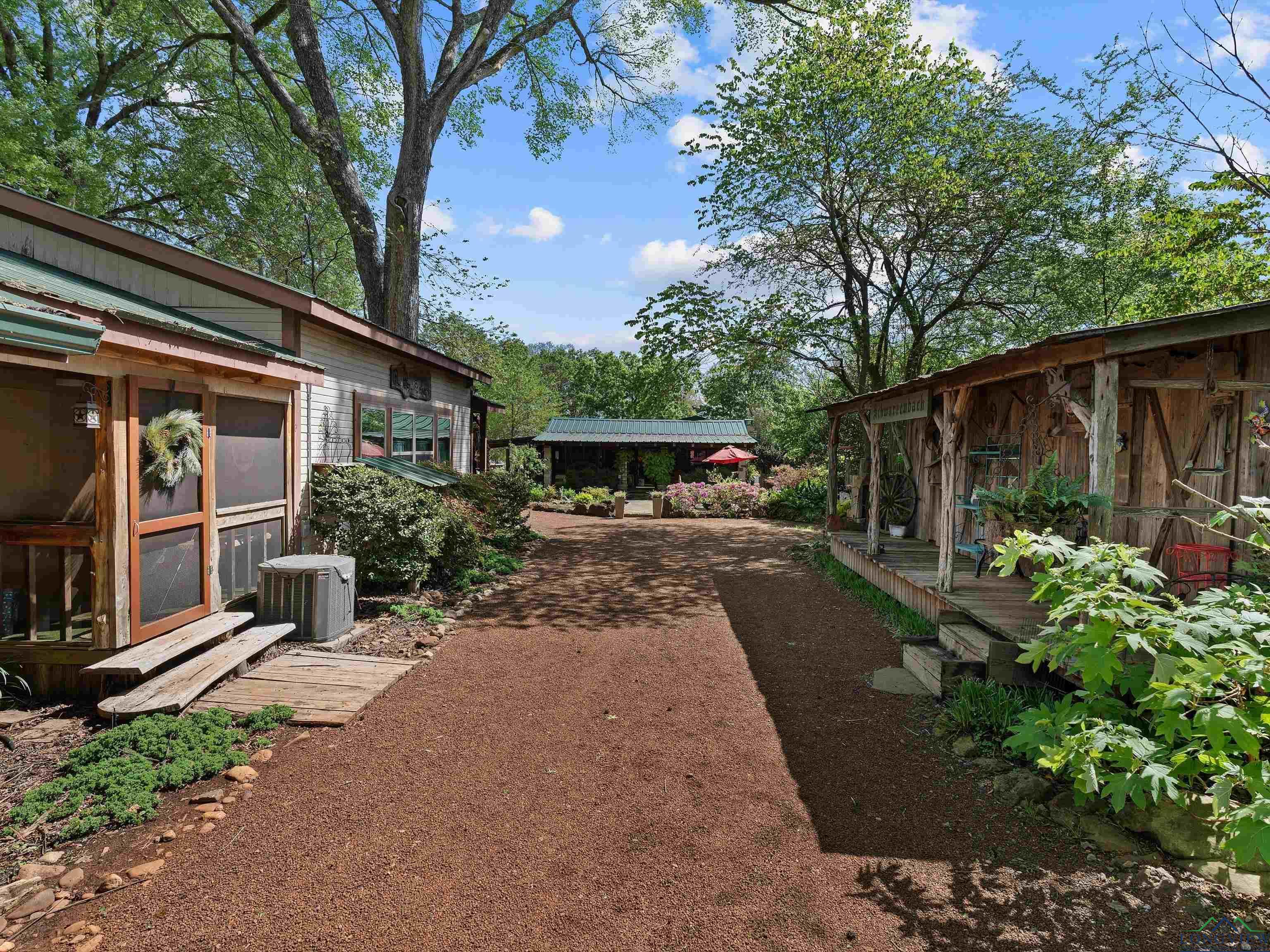 Image 1: View of yard featuring a sunroom, Yard