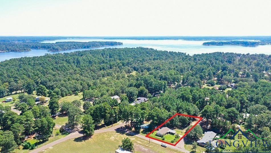 Image 2: Aerial overview of property's location featuring property parcel outlined and a large body of water, Aerial View