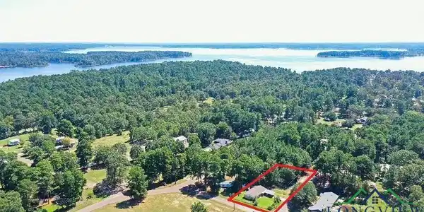 Image 2: Aerial overview of property's location featuring property parcel outlined and a large body of water, Aerial View