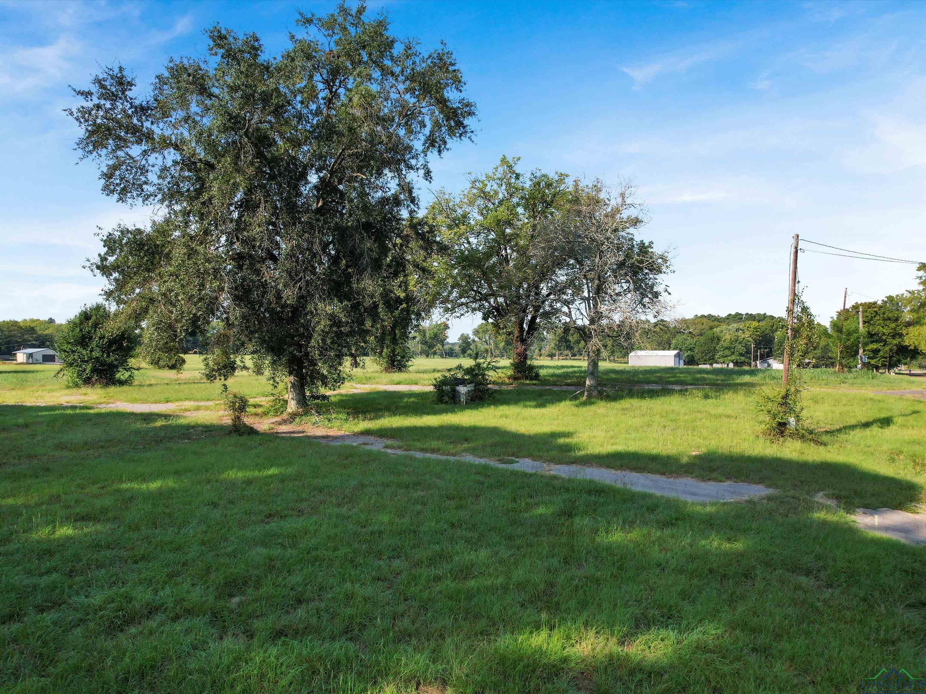 Image 3: View of property's community featuring a yard, Community