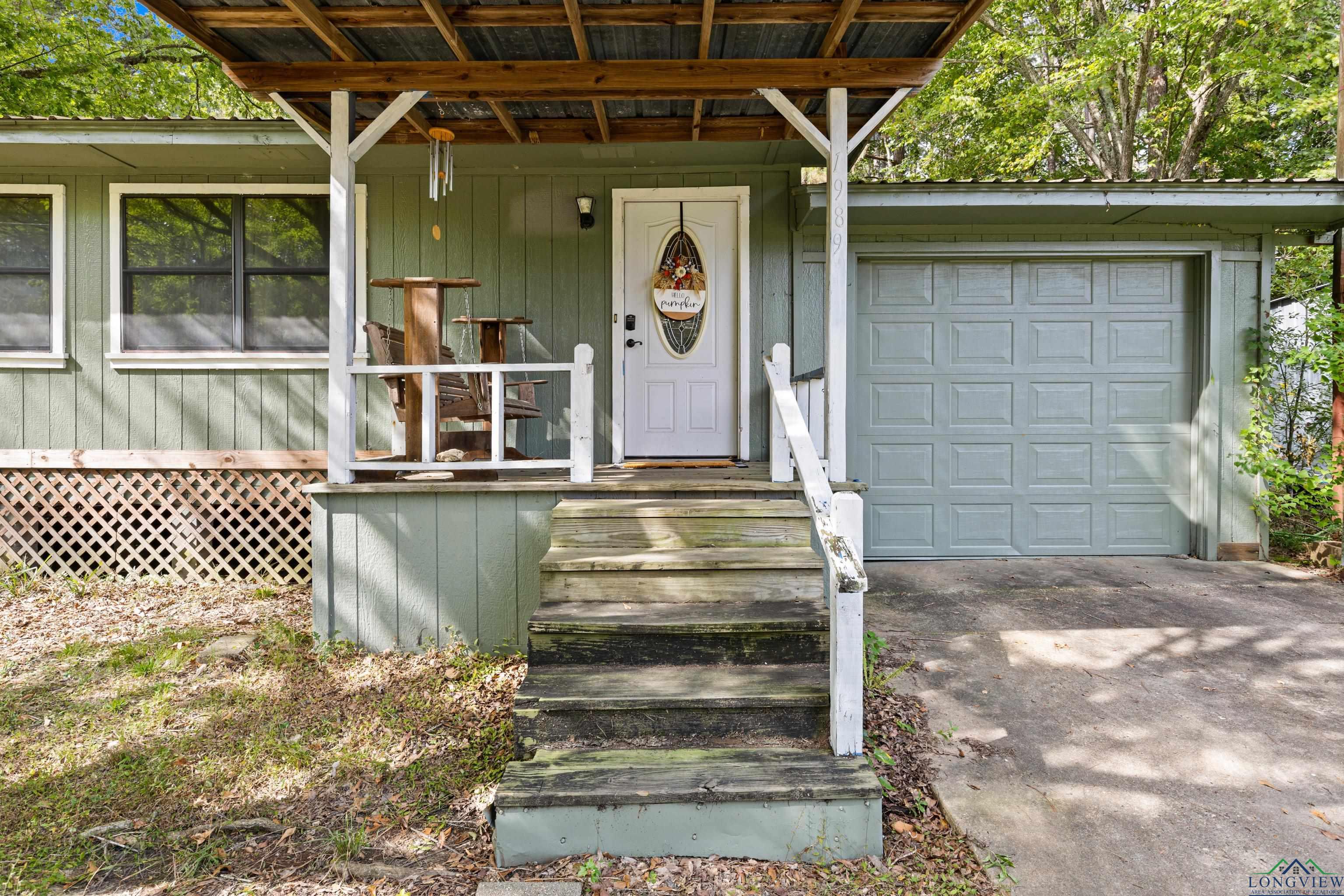Image 1: Property entrance with a porch and driveway, Front Porch