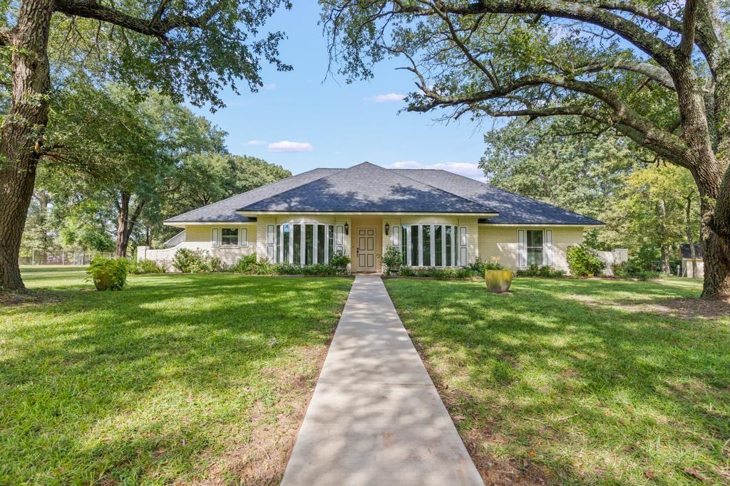 Image 0: Single story home featuring a front yard and a shingled roof, Front Of Structure