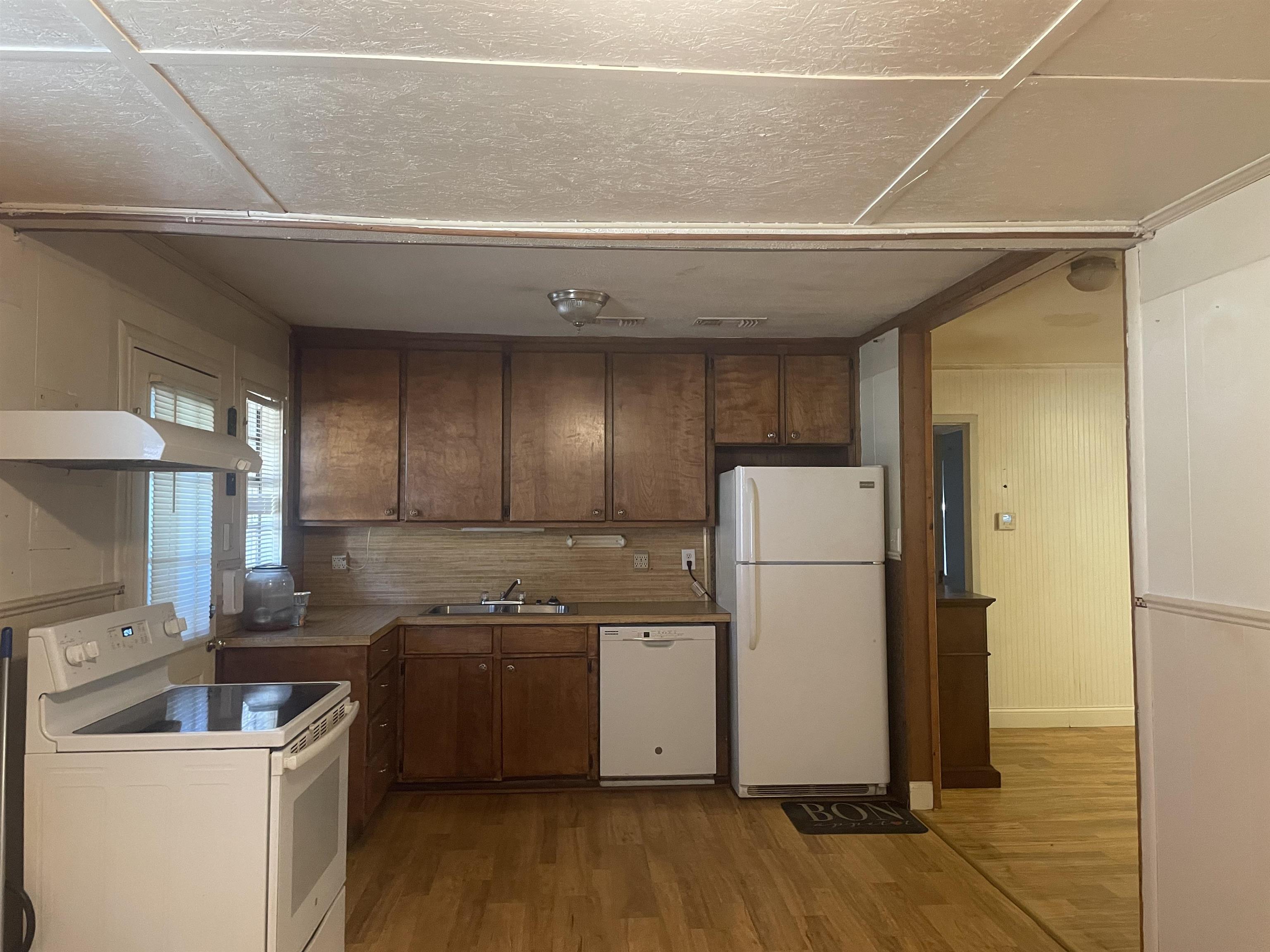 Image 2: Kitchen featuring wood-finish flooring and wood cabinetry, Kitchen