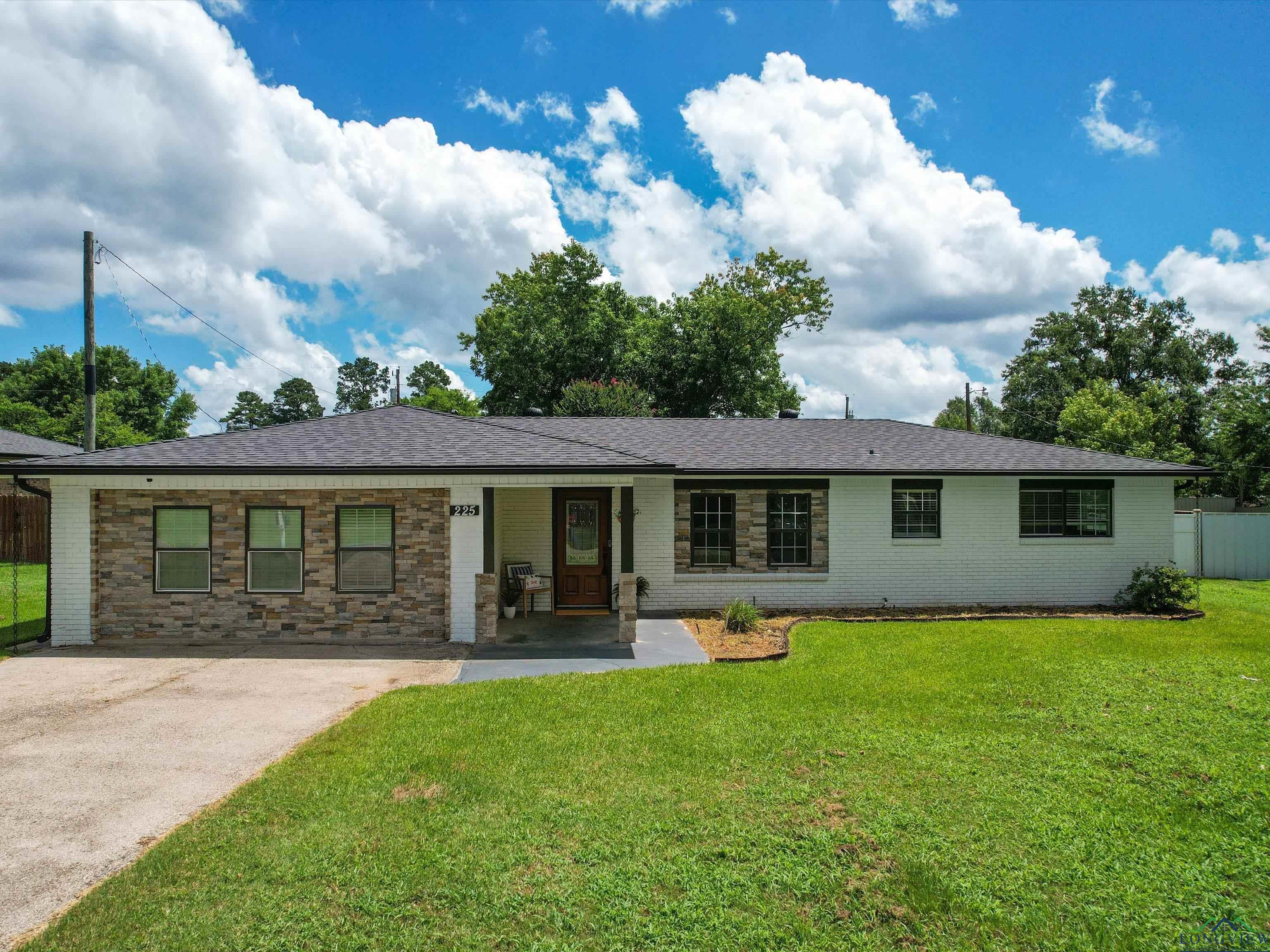 Image 0: Ranch-style house featuring brick siding and a porch, Front Of Structure