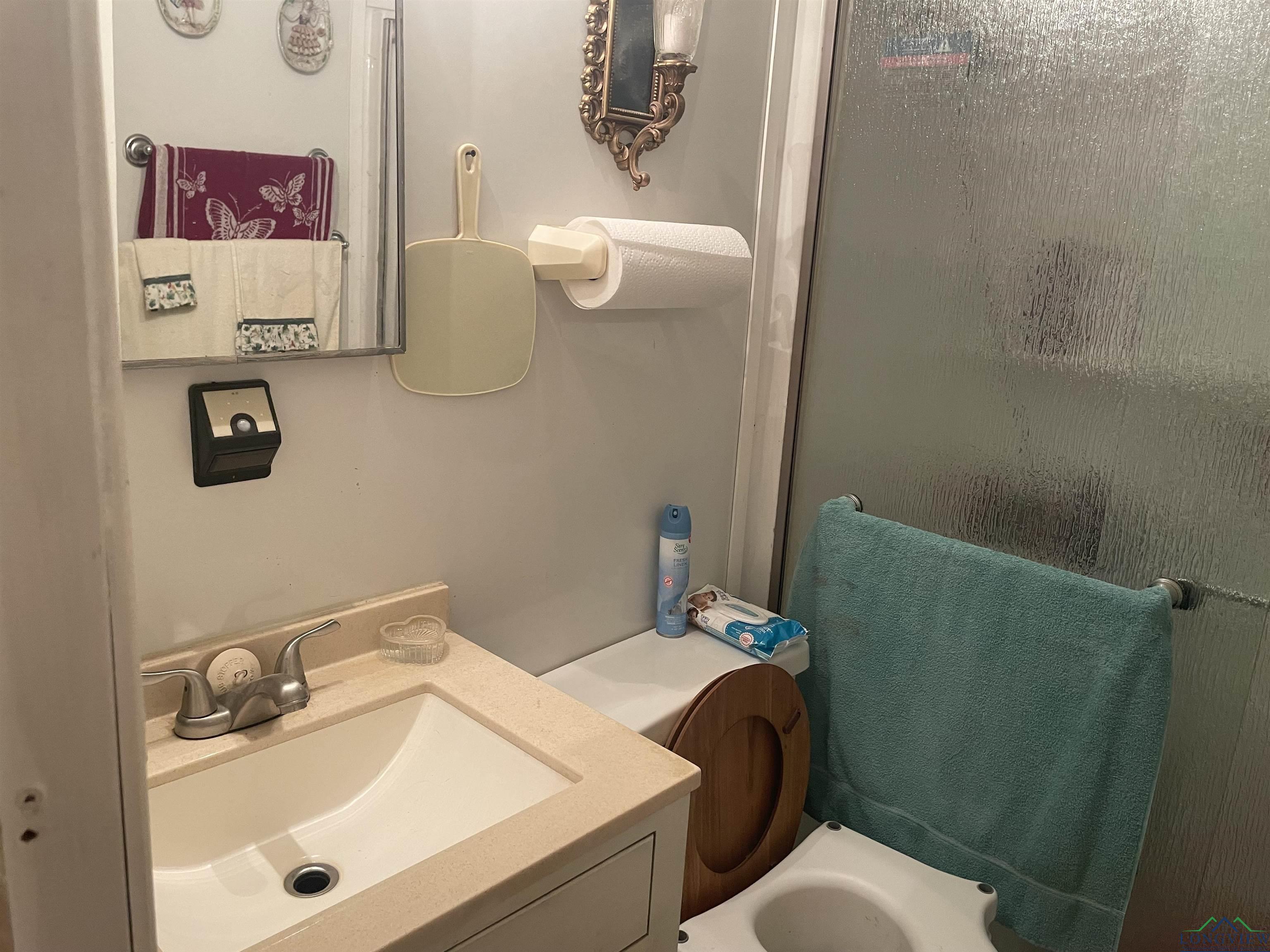 Image 3: Full bath featuring vanity and a shower with door, Bathroom