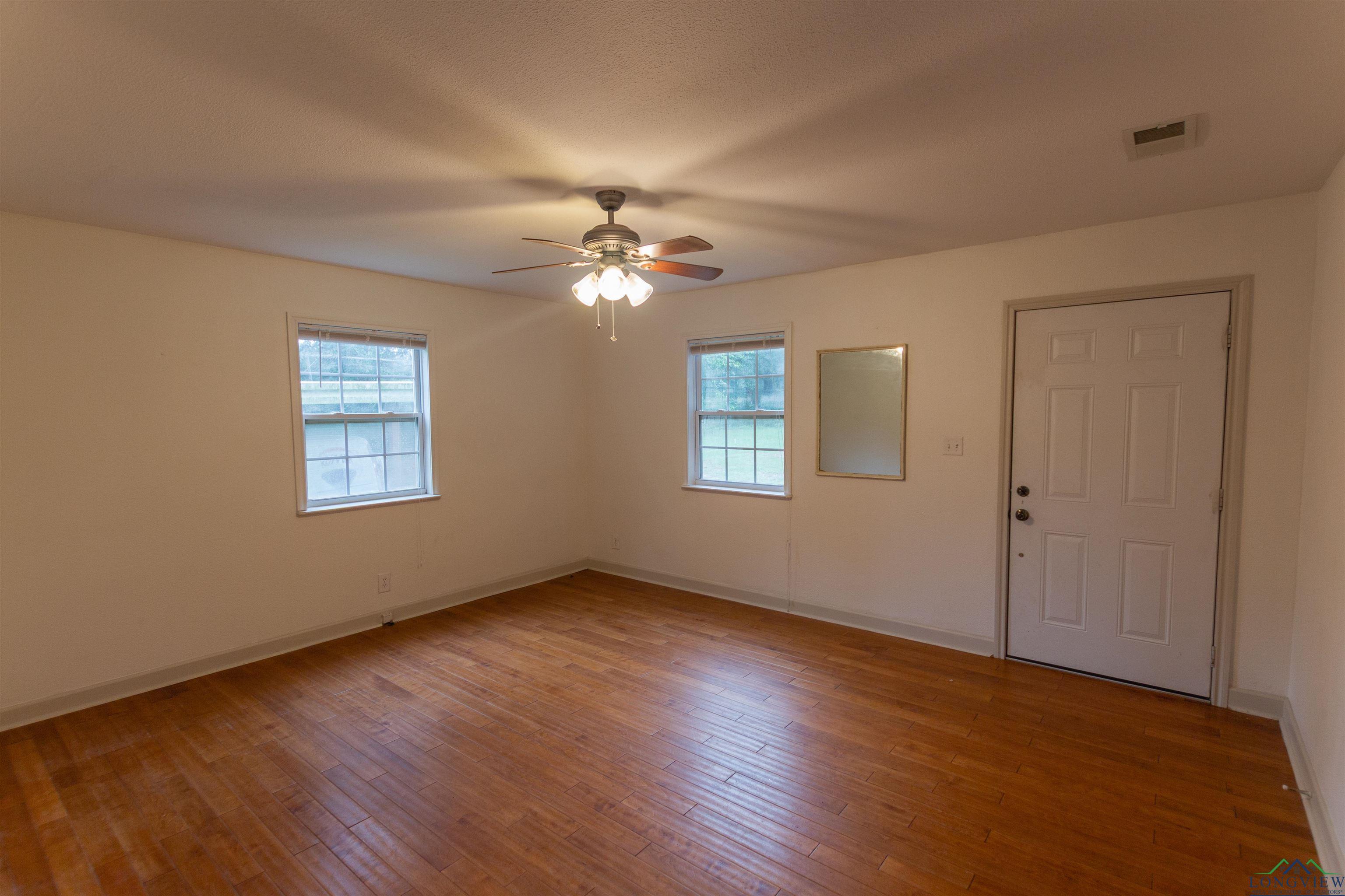 Image 3: Entrance foyer with healthy amount of natural light, light wood finished floors, and a ceiling fan, Entrance Foyer