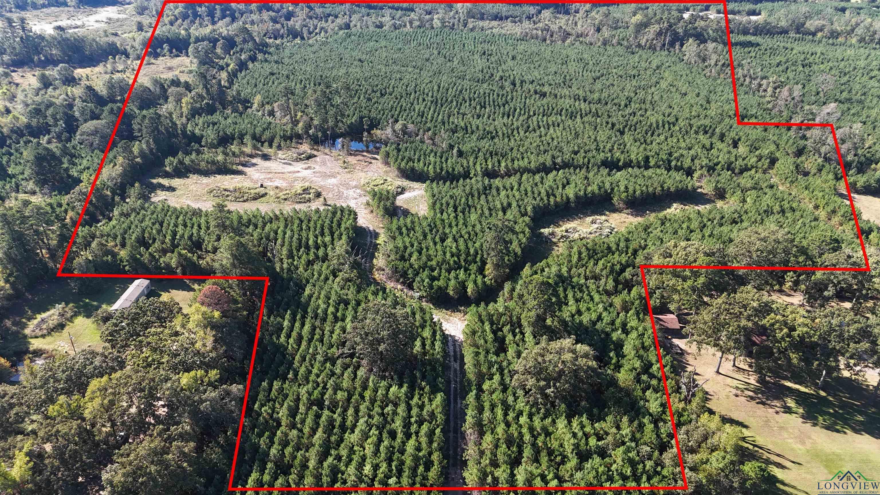 Image 2: Aerial overview of property's location featuring property parcel outlined, Aerial View