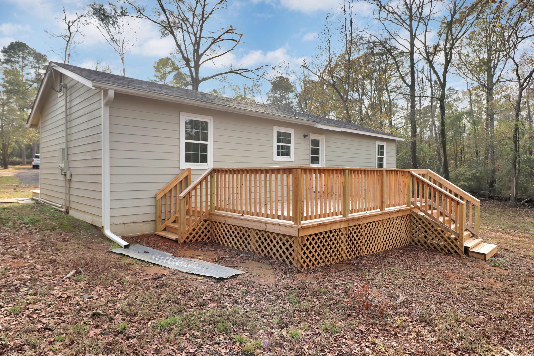 Image 3: Back of property with a deck, Back Of Structure