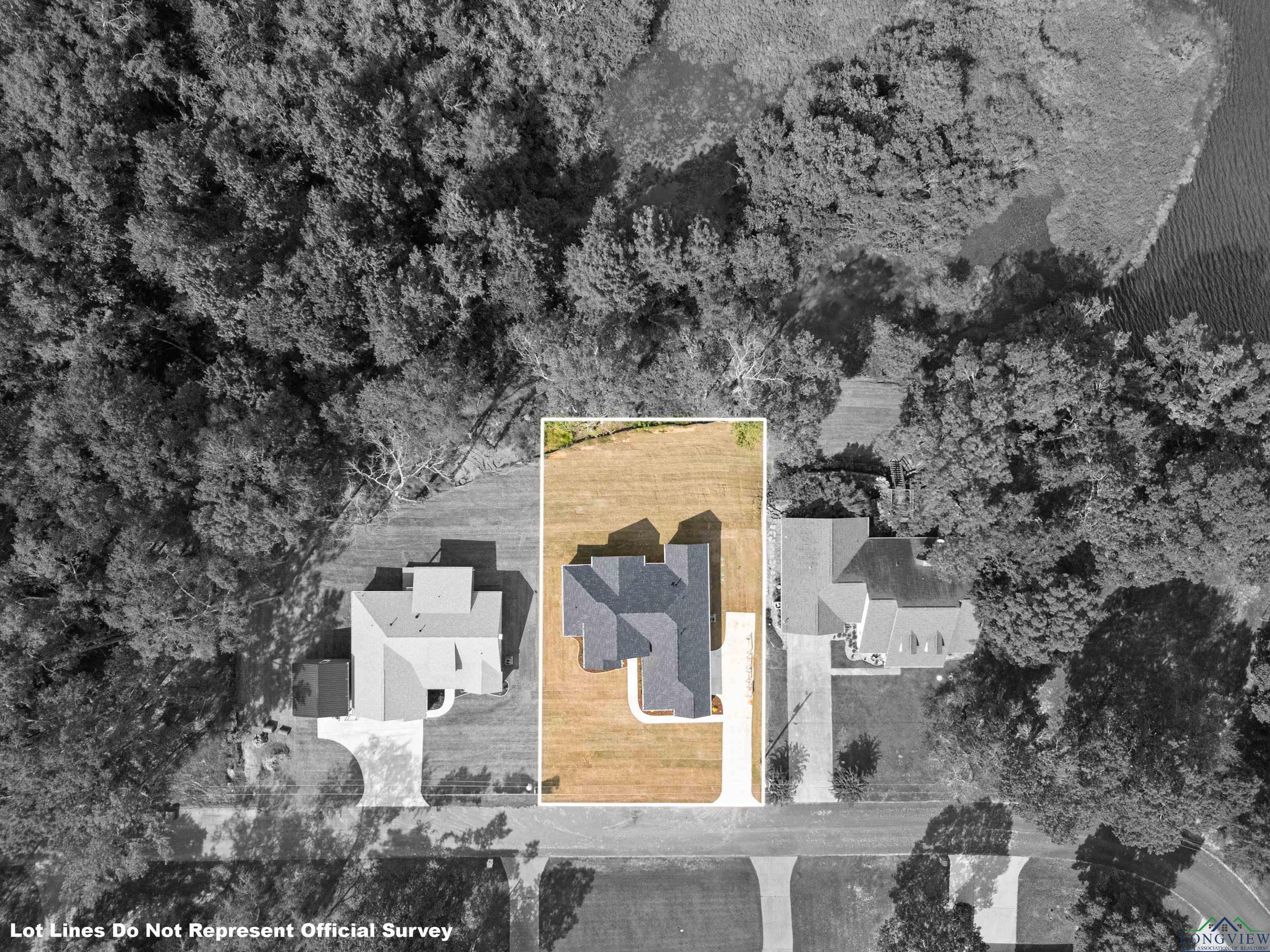 Image 1: Aerial view of property and surrounding area featuring property boundaries highlighted, Aerial View