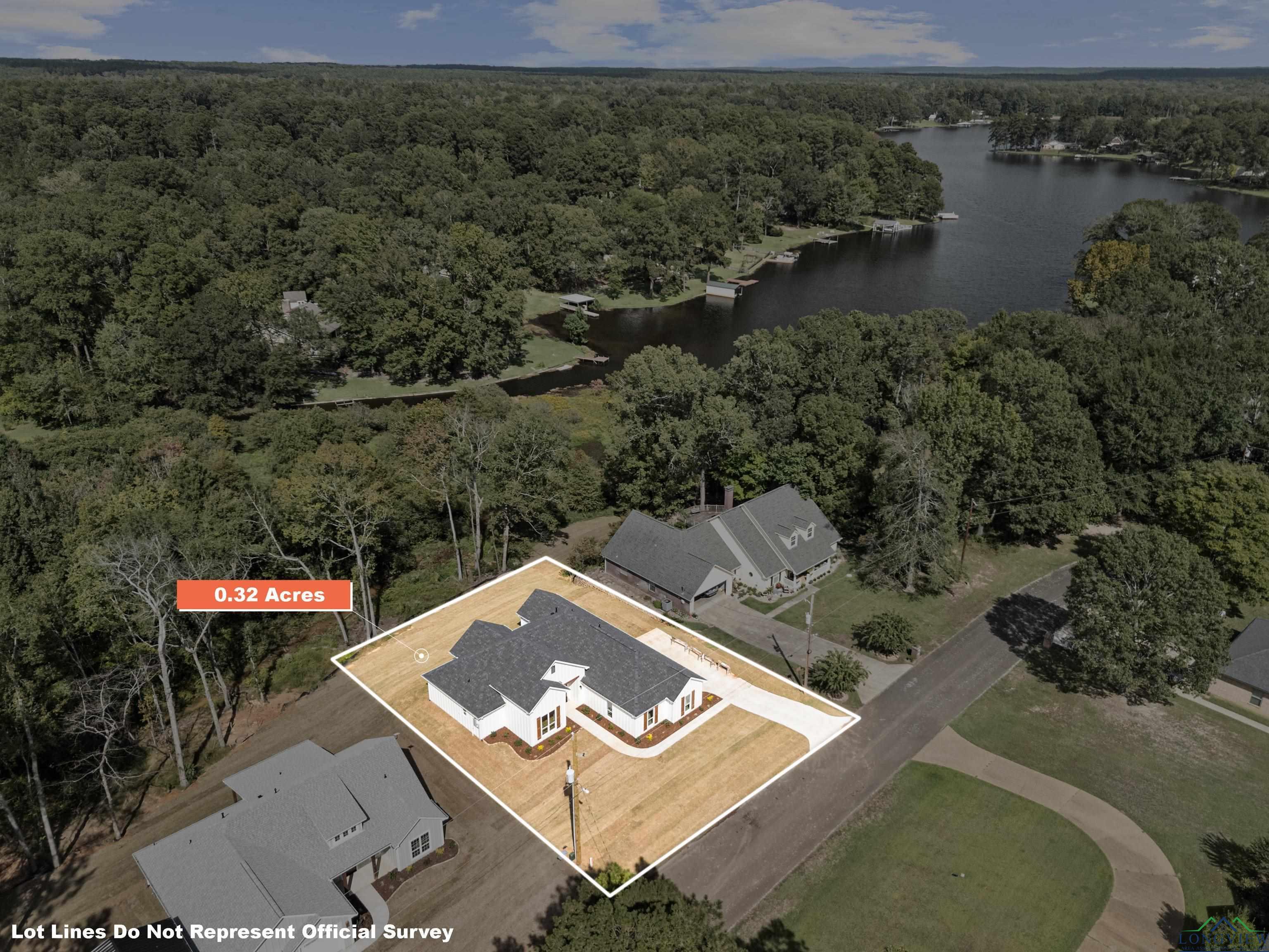 Image 3: View of property location featuring a heavily wooded area and property parcel outlined, Aerial View
