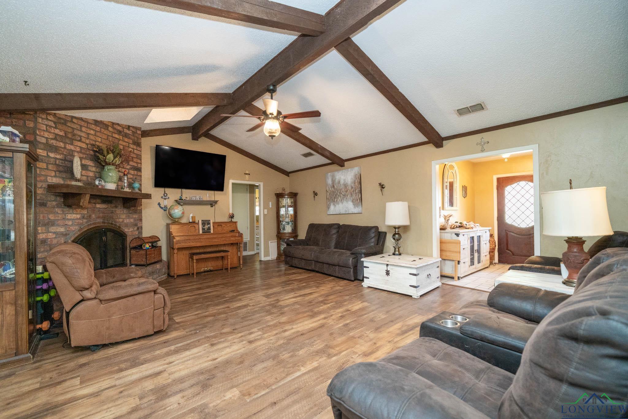 Image 2: Den with brick fireplace, Den
