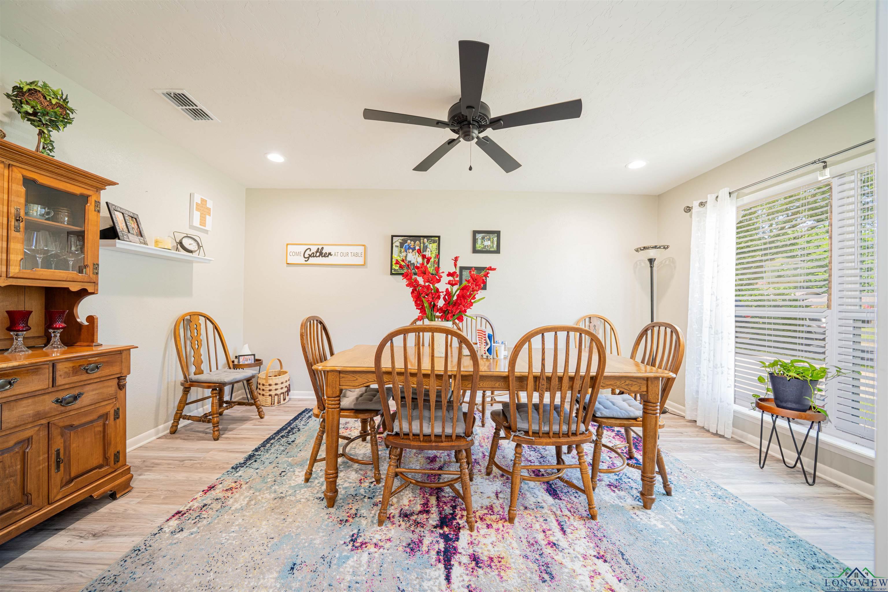Image 1: Dining space with ceiling fan, light wood-type flooring, and recessed lighting, Dining Area