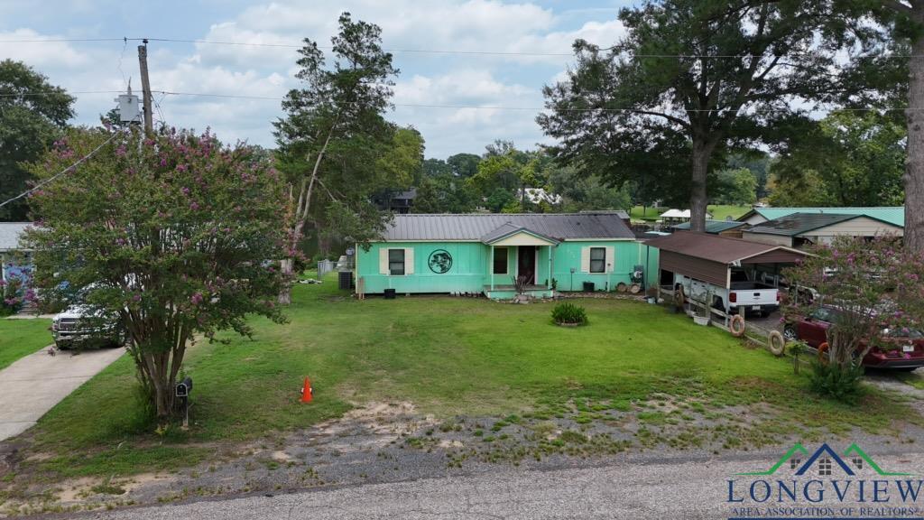 Image 2: View of front facade with a front lawn, Front Of Structure