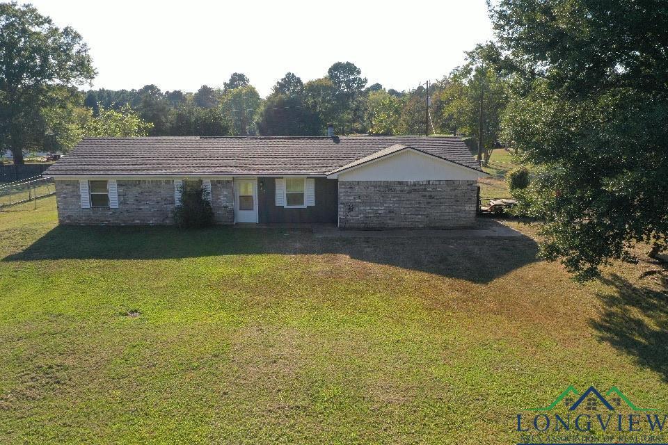 Image 0: Single story home with brick siding and a front yard, Front Of Structure
