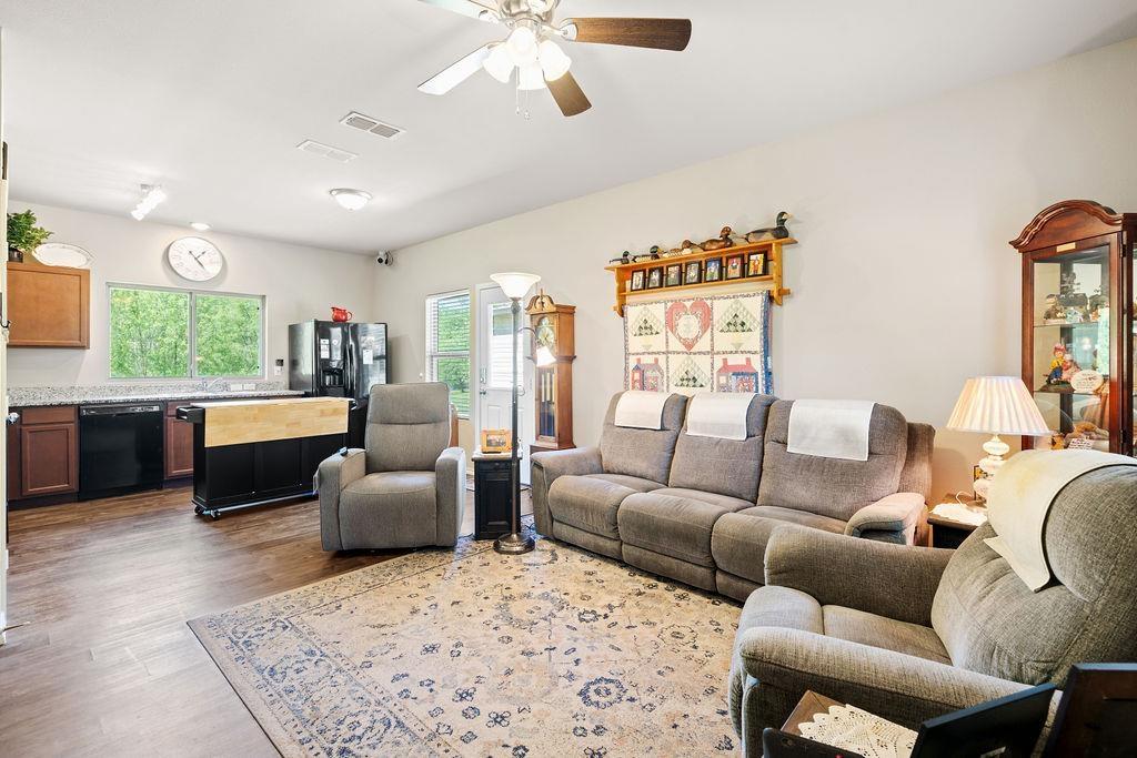 Image 3: Living room featuring a ceiling fan and dark wood finished floors, Living Room