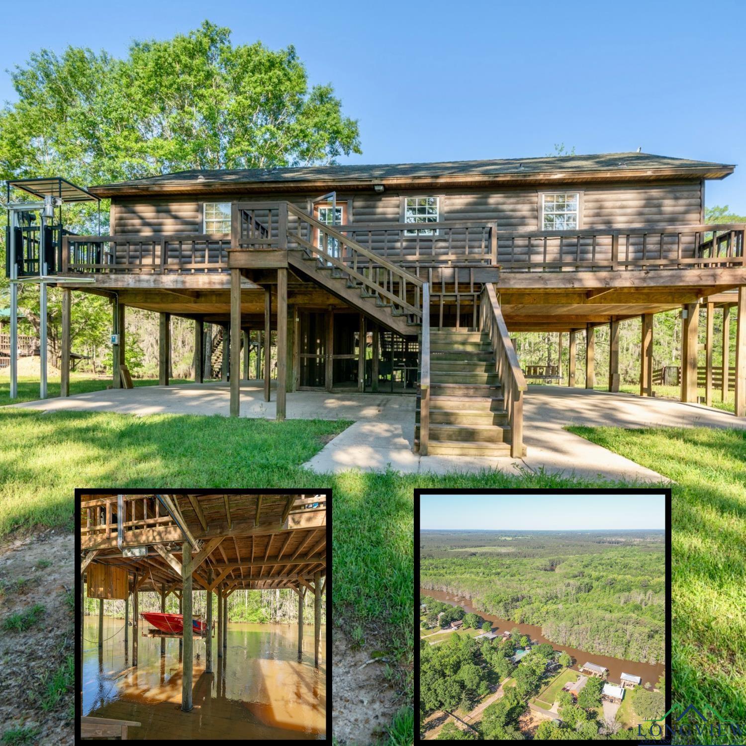 Image 0: View of property's community with stairs, a wooden deck, and a yard, Community