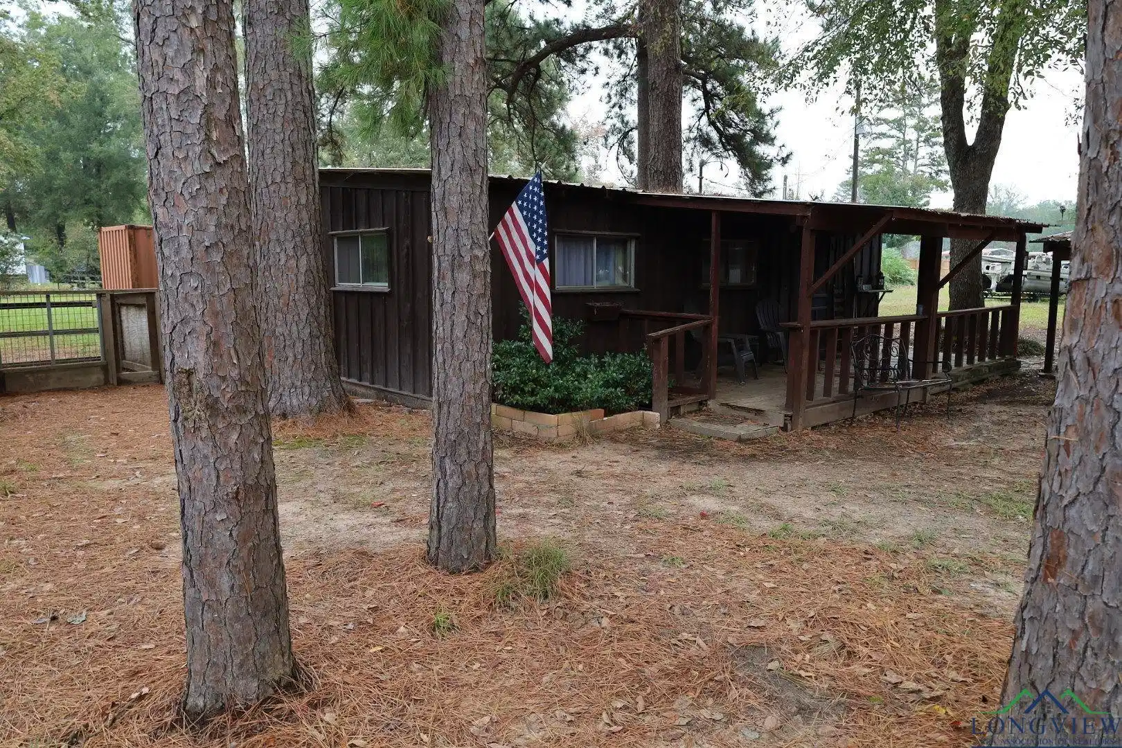 Image 0: Rear view of property with a wooden deck, Back Of Structure