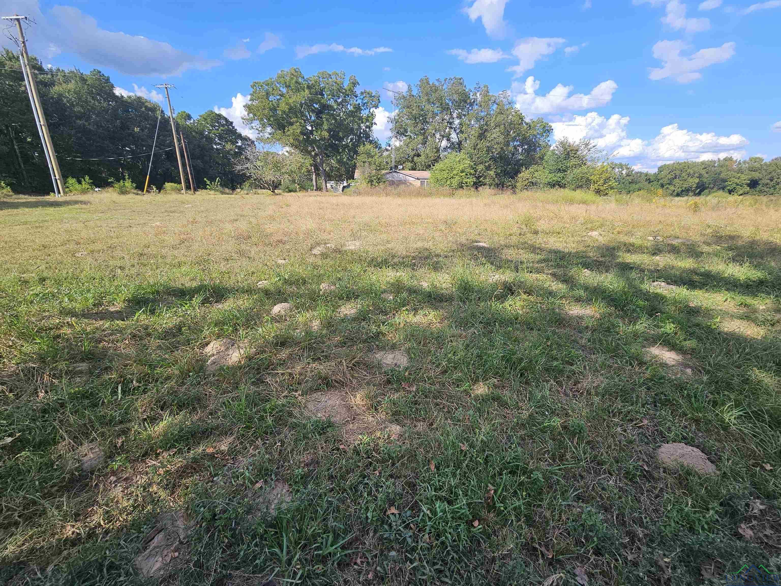 Image 0: View of yard featuring a view of rural / pastoral area, Yard
