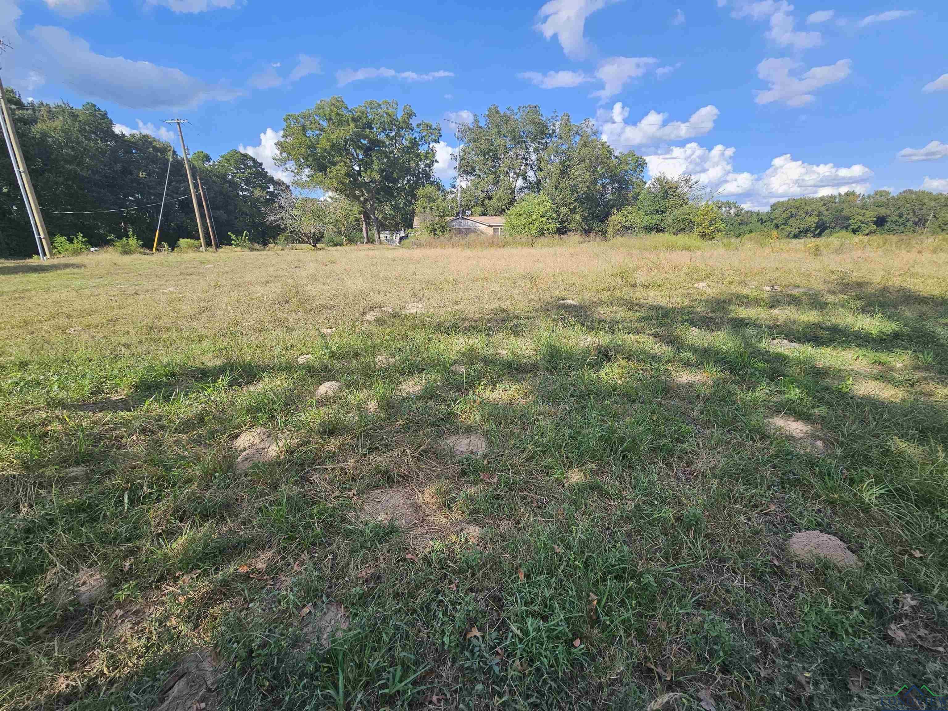 Image 1: View of yard featuring a rural view, Yard