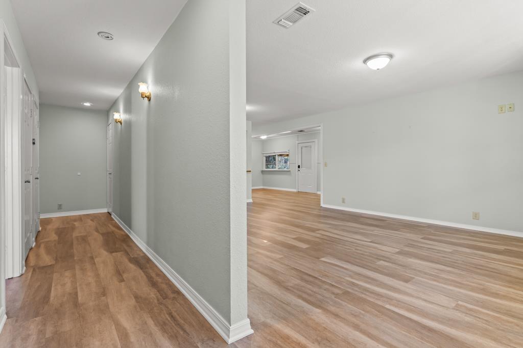 Image 3: Hallway featuring light wood-type flooring and baseboards, Hallway