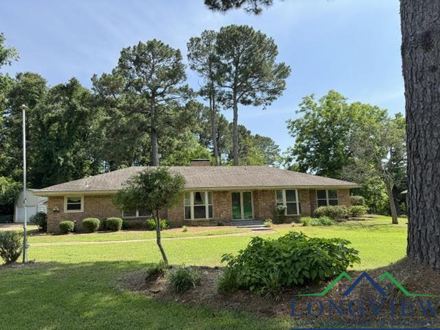 Image 0: Single story home featuring a front yard, an outbuilding, and brick siding, Front Of Structure