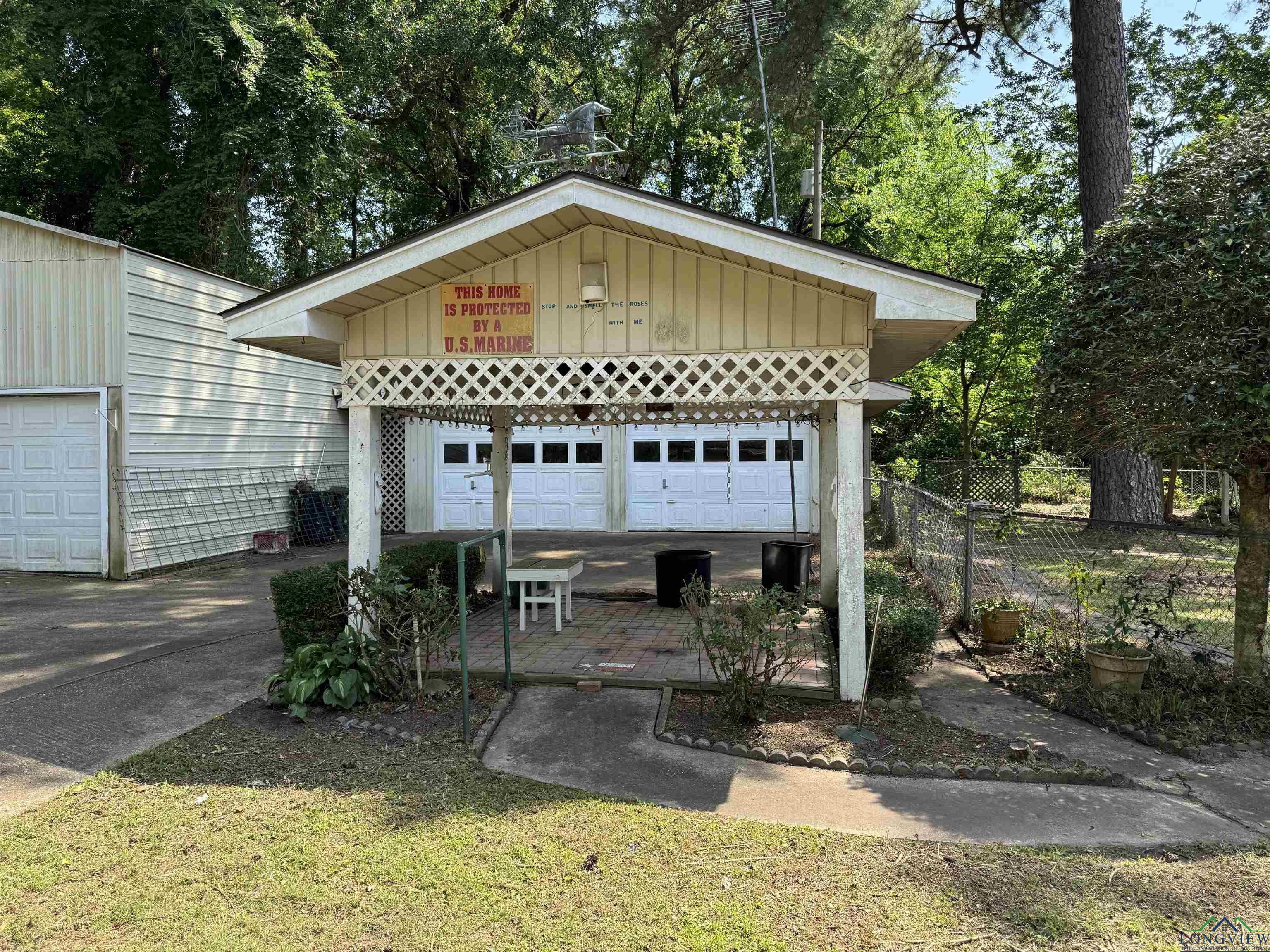 Image 2: Detached garage featuring view of scattered trees, Garage