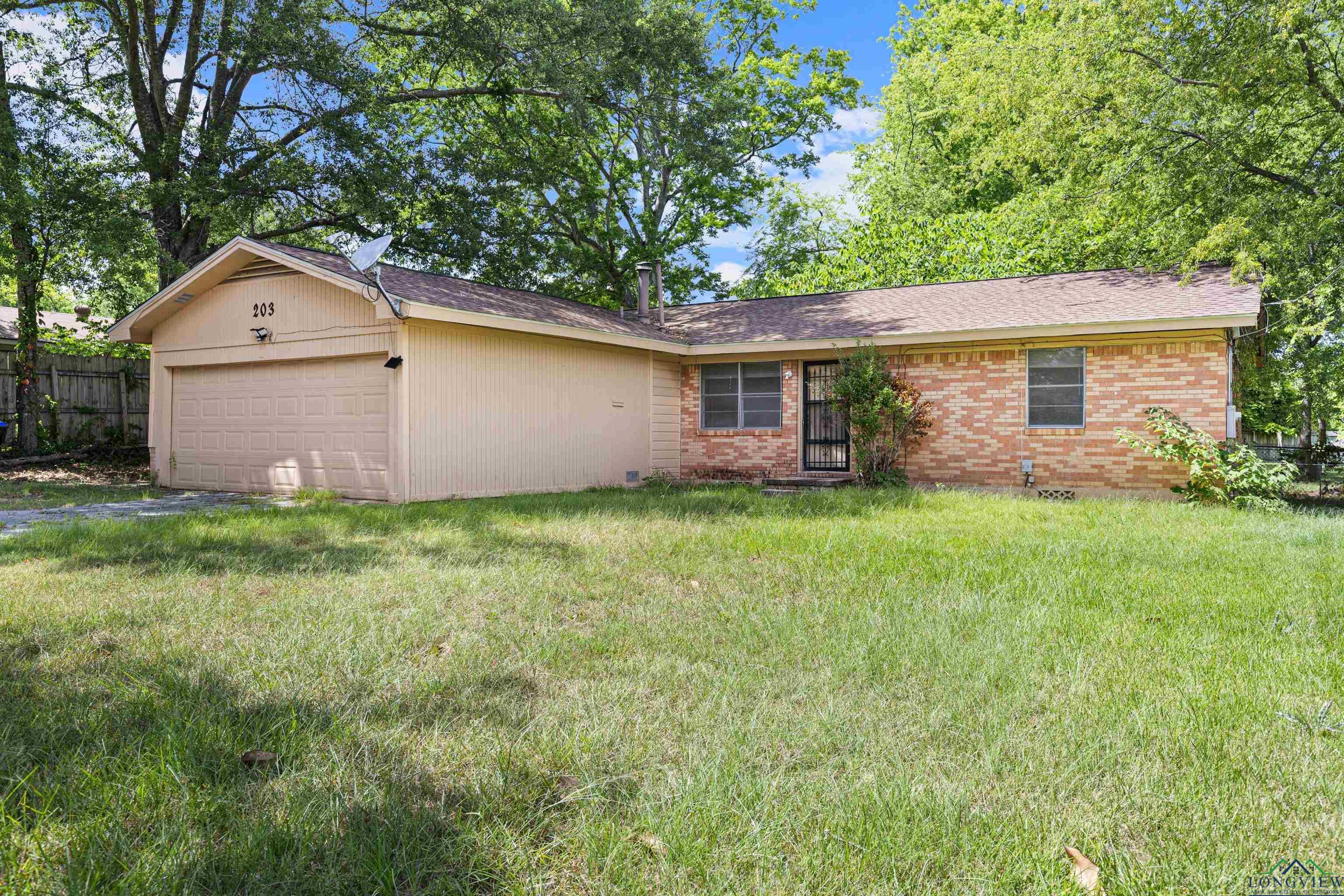 Image 0: Ranch-style house featuring brick siding, a garage, and a shingled roof, Front Of Structure