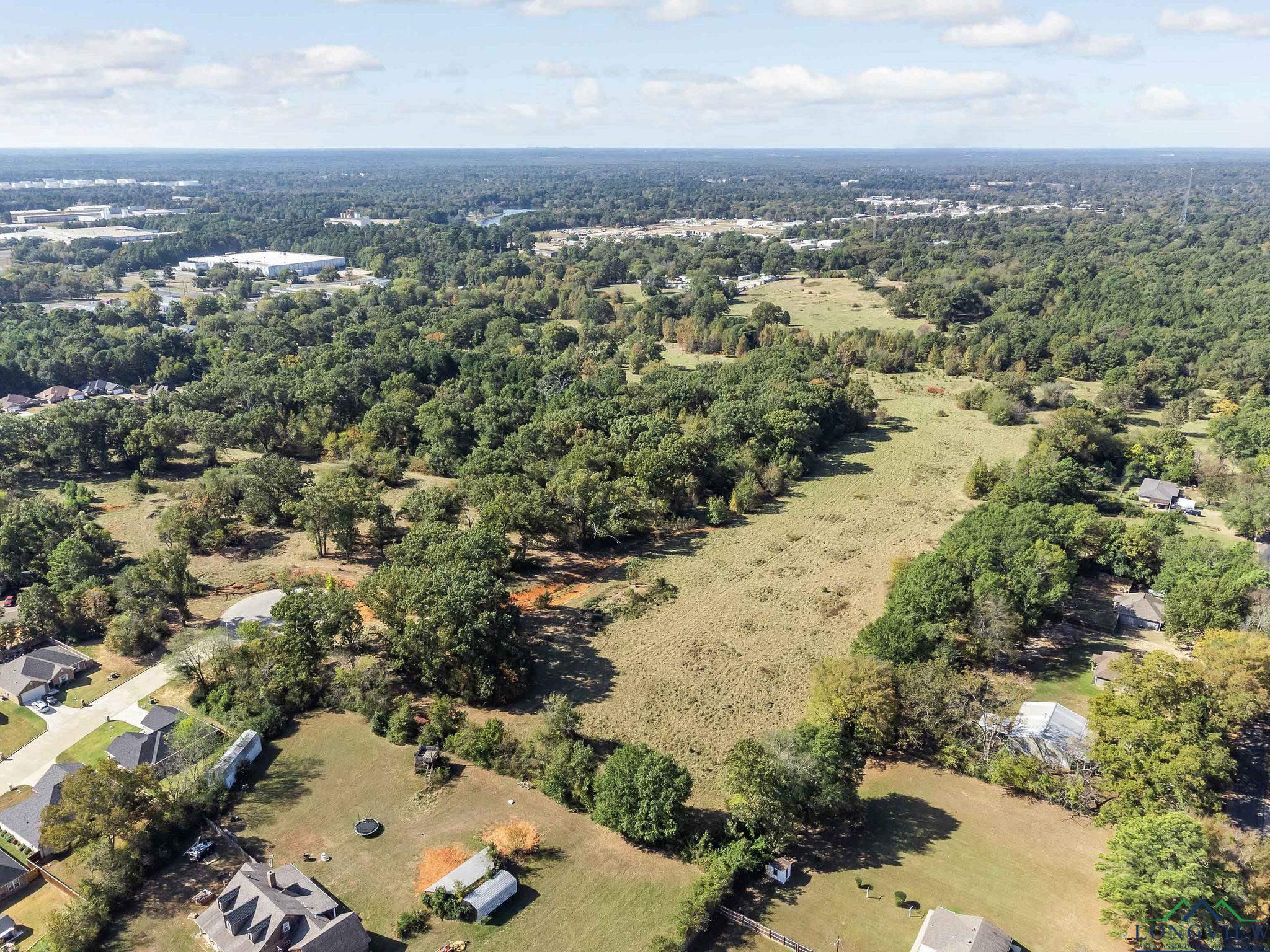 Image 3: View of property location featuring a forest, Aerial View