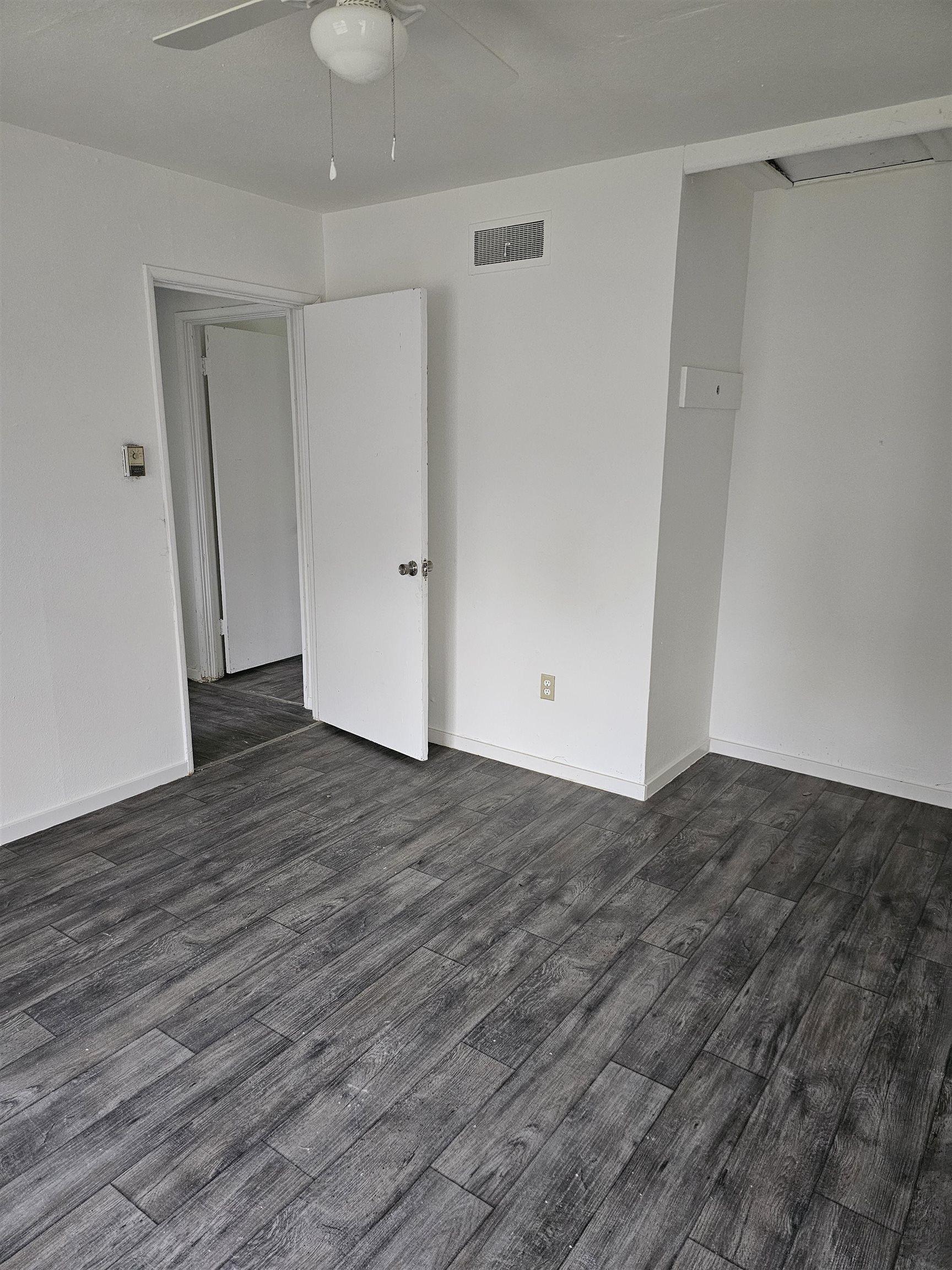 Image 1: Unfurnished room with dark wood-style floors, Other