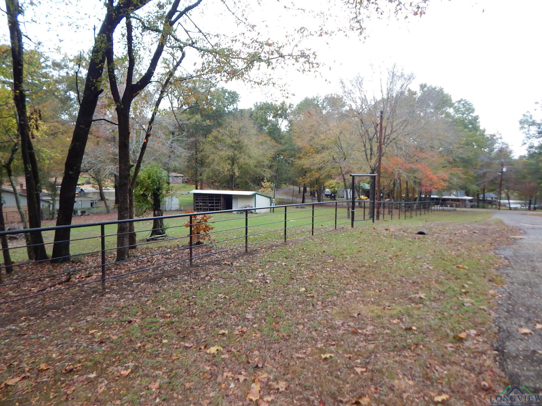 Image 3: View of yard featuring an outdoor structure, Yard